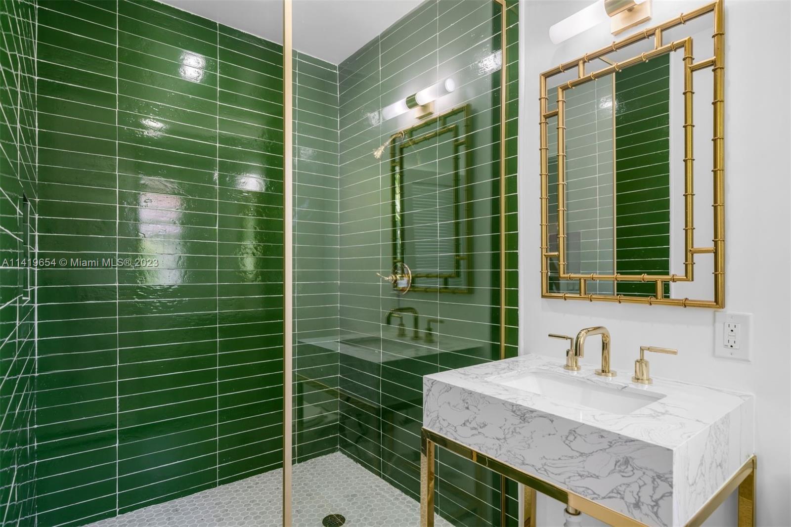 60 Park Drive, Unit D Bal Harbour, FL 33154 - Photo 10 of 11 a bathroom with a sink and a mirror