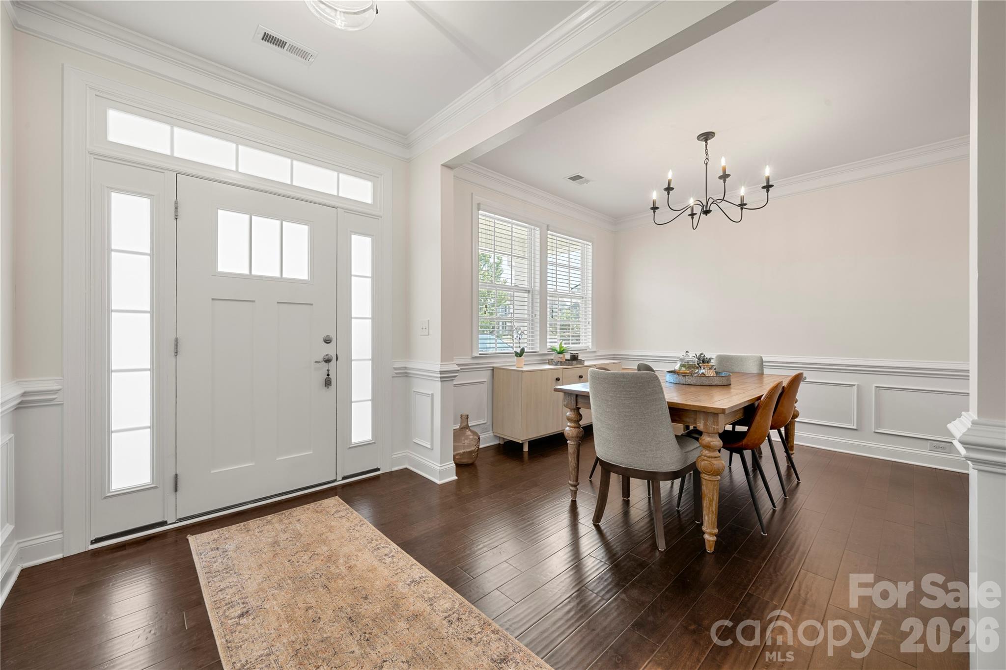 11266 Trailside Road Concord, NC 28027 - Photo 4 of 48 a view of a dining room with furniture and wooden floor