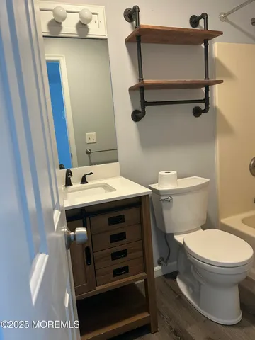 a view of a wooden deck next to a yard