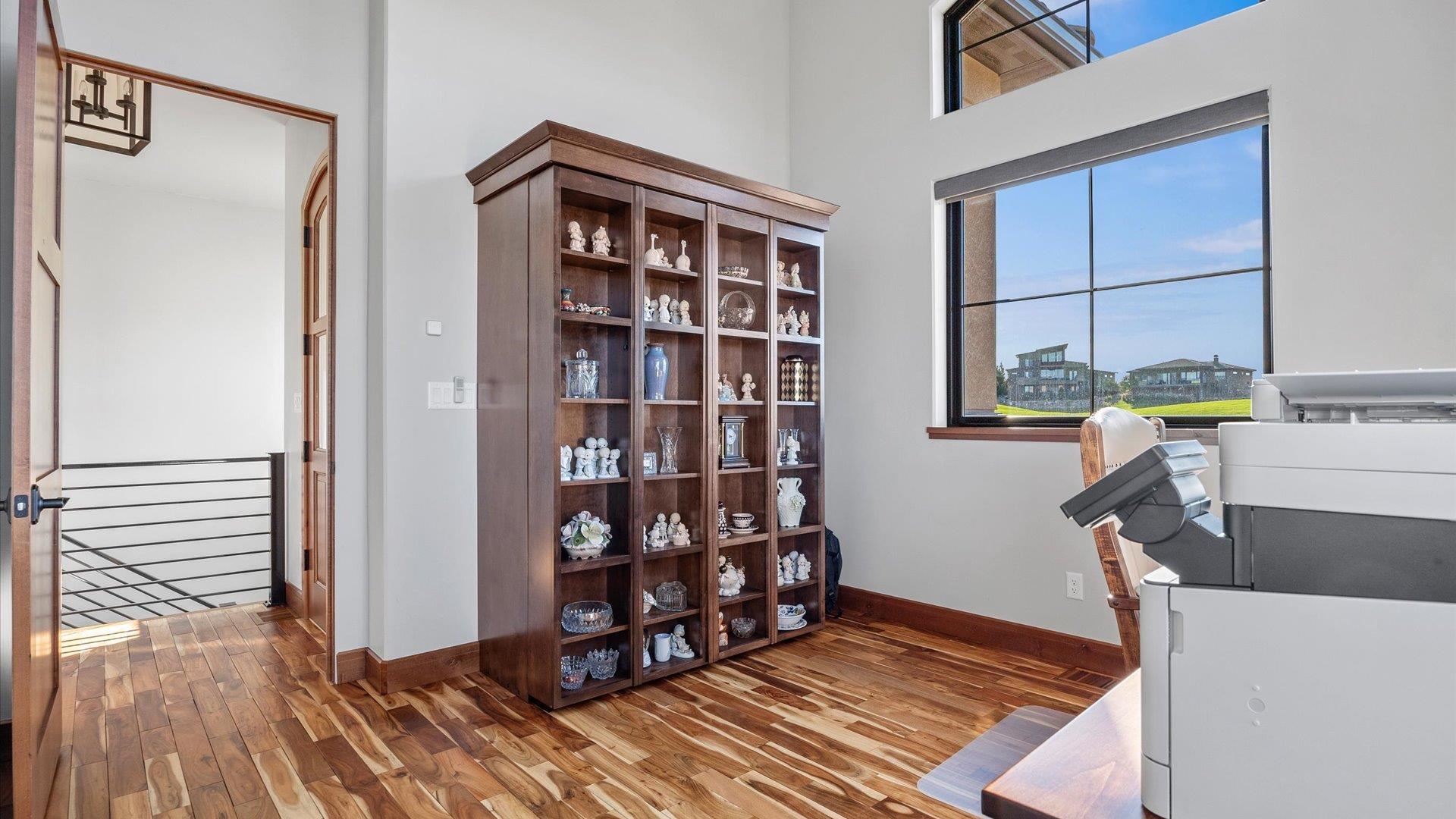 379 High Desert Road Grand Junction, CO 81507 - Photo 19 of 42 a view of wooden floor and windows in a room