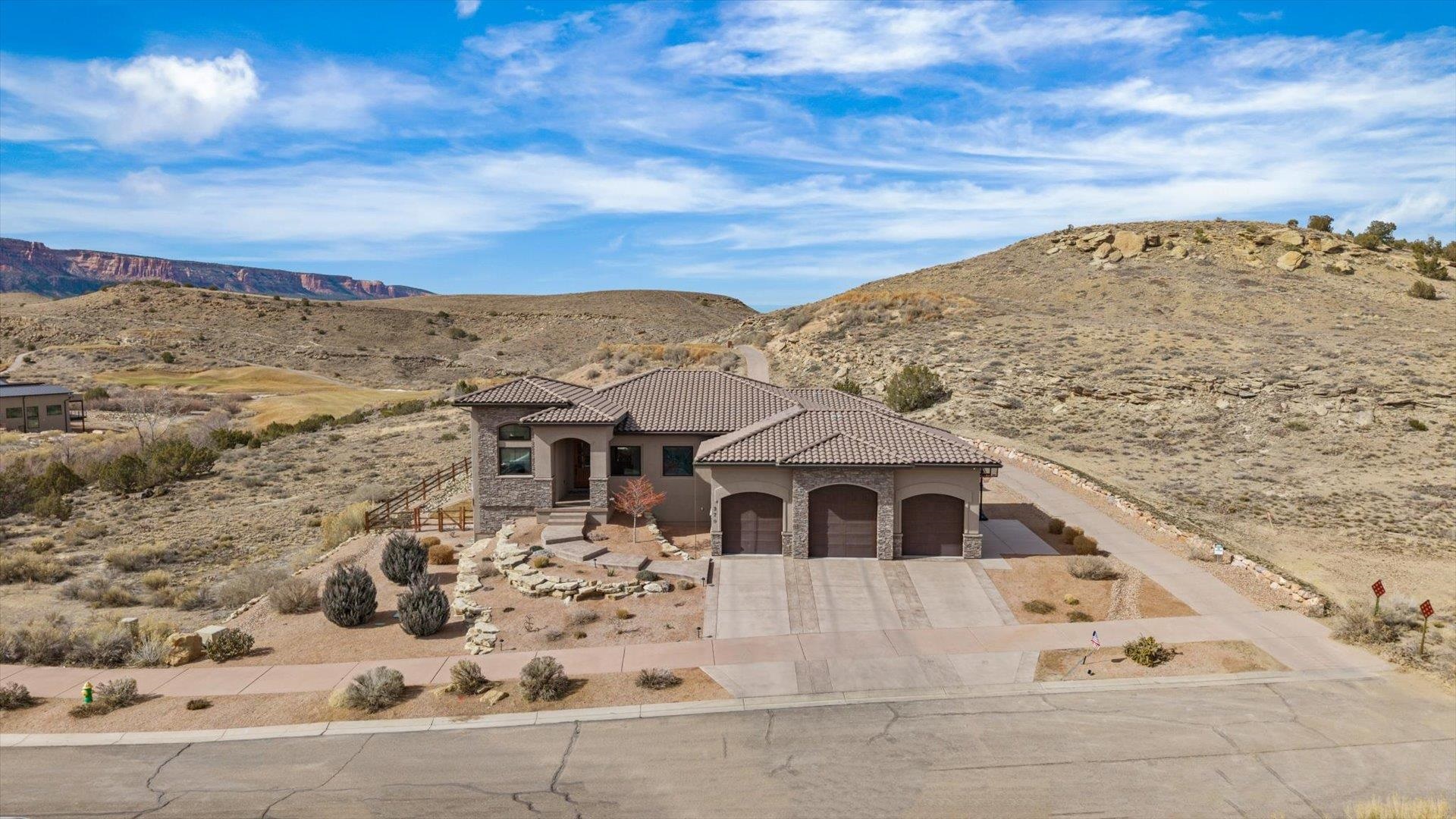 379 High Desert Road Grand Junction, CO 81507 - Photo 2 of 42 a front view of a house with a yard