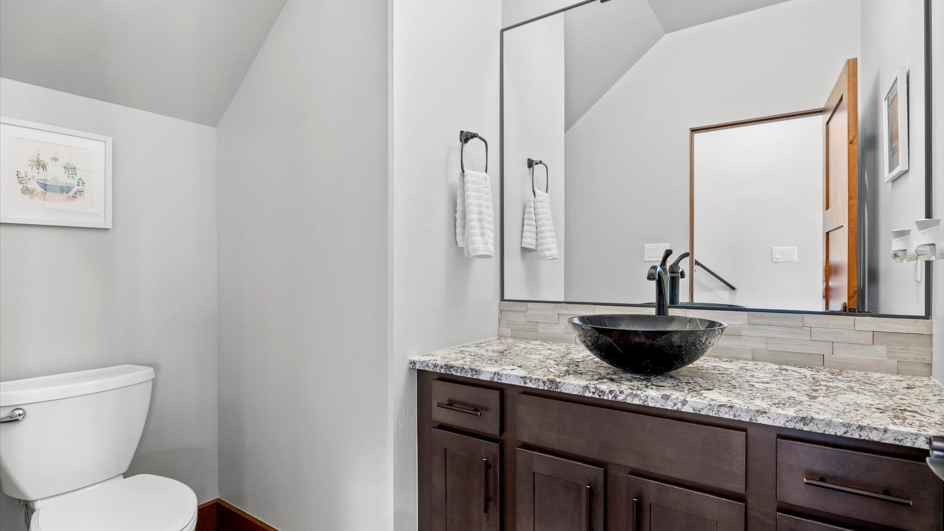 379 High Desert Road Grand Junction, CO 81507 - Photo 24 of 42 a bathroom with a granite countertop toilet and a sink
