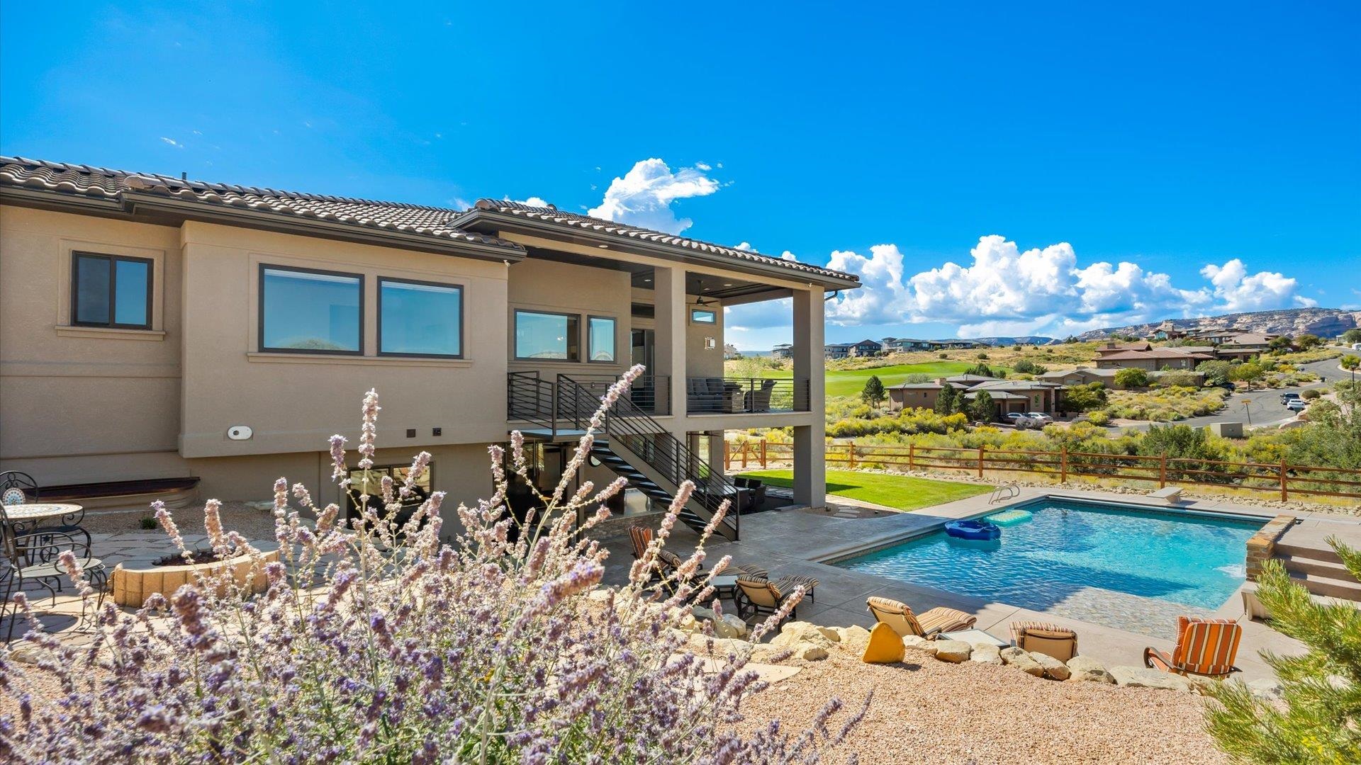 379 High Desert Road Grand Junction, CO 81507 - Photo 34 of 42 a view of a swimming pool with a patio
