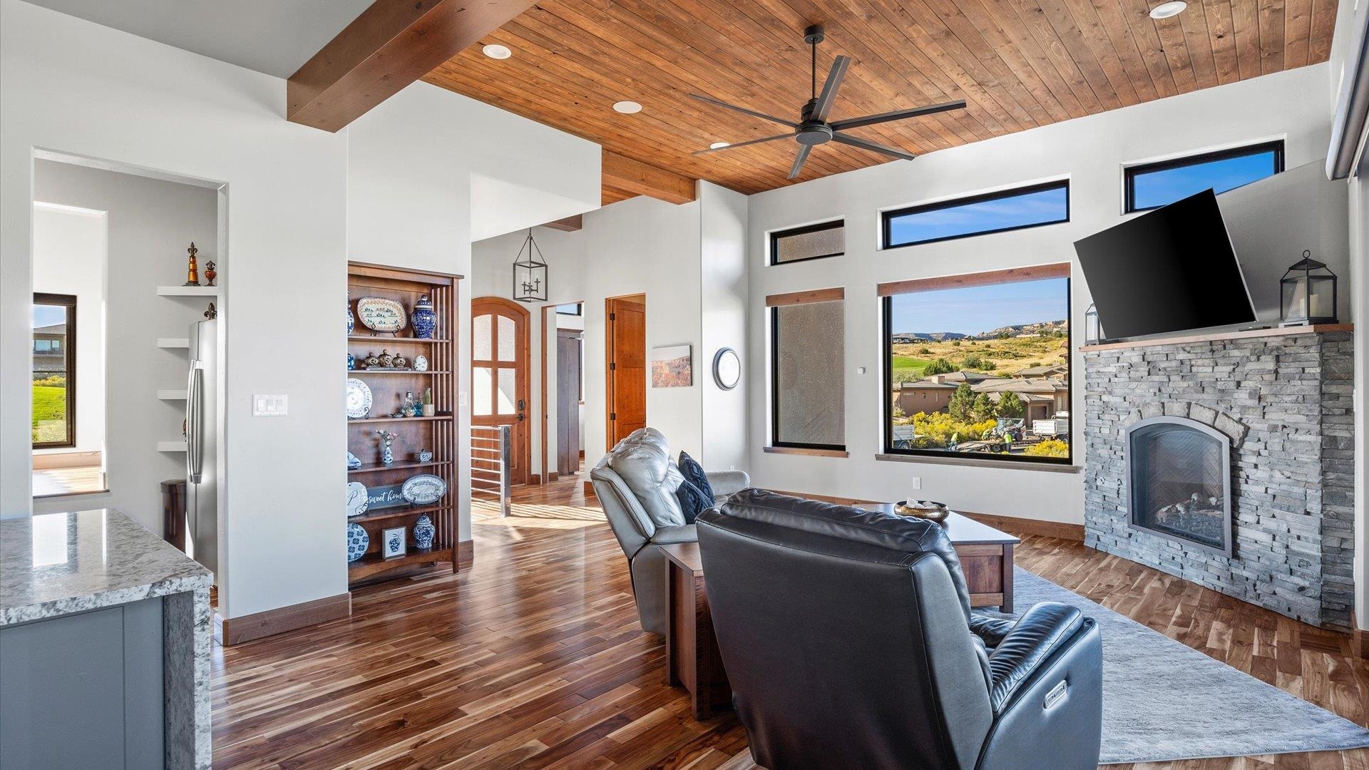 379 High Desert Road Grand Junction, CO 81507 - Photo 5 of 42 a living room with furniture and a fireplace
