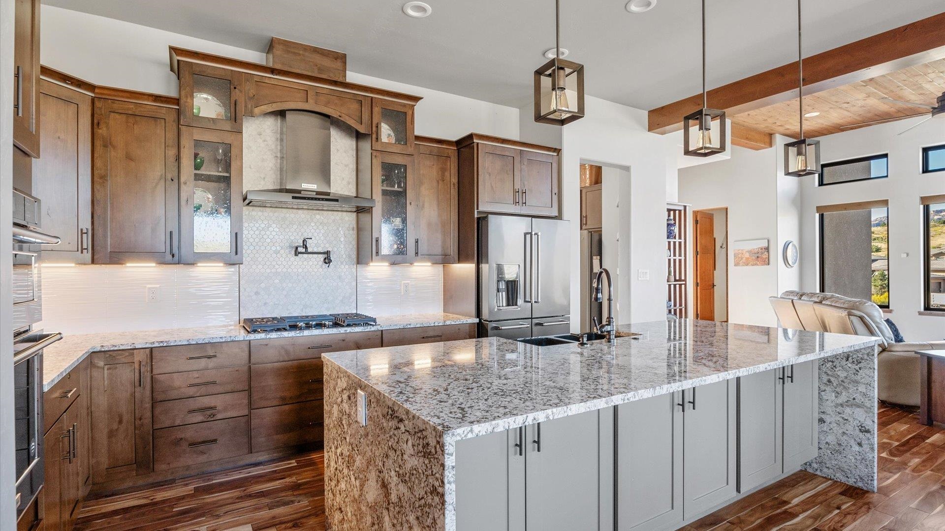 379 High Desert Road Grand Junction, CO 81507 - Photo 9 of 42 a kitchen with stainless steel appliances granite countertop a sink and a refrigerator