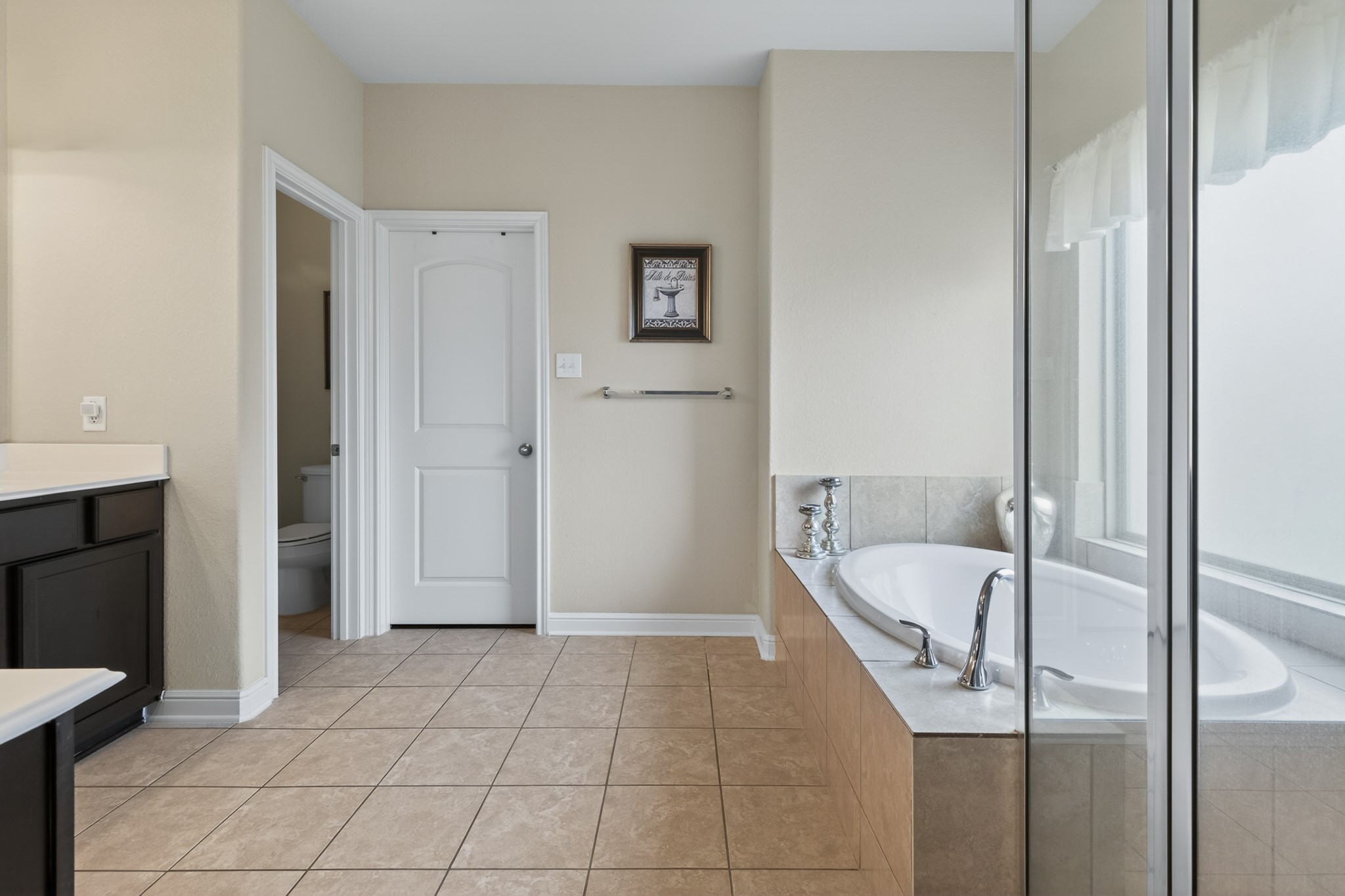 24711 East Burnaby Circle Spring, TX 77373 - Photo 14 of 20 a bathroom with a tub and shower