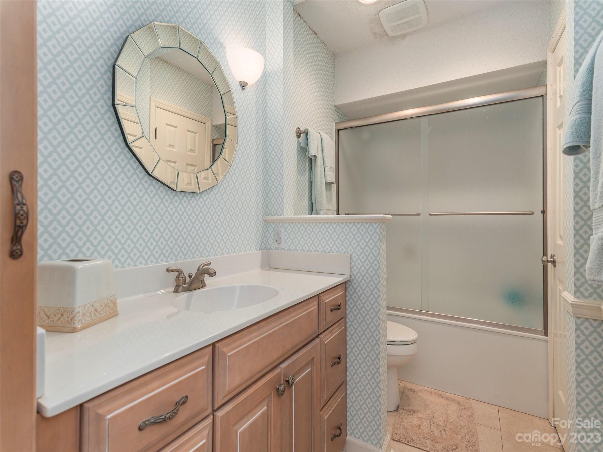 106 Beaver Ridge Road Asheville, NC 28804 - Photo 17 of 19 a bathroom with a sink and a mirror