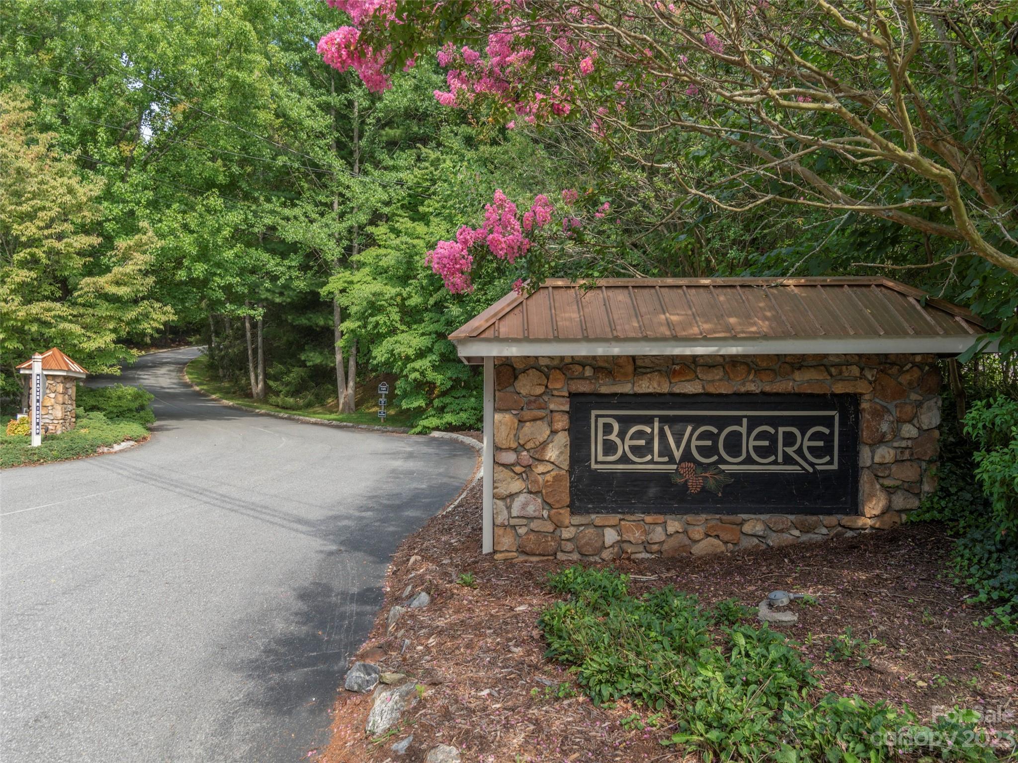 106 Beaver Ridge Road Asheville, NC 28804 - Photo 19 of 19 a sign that is sitting in front of flowers