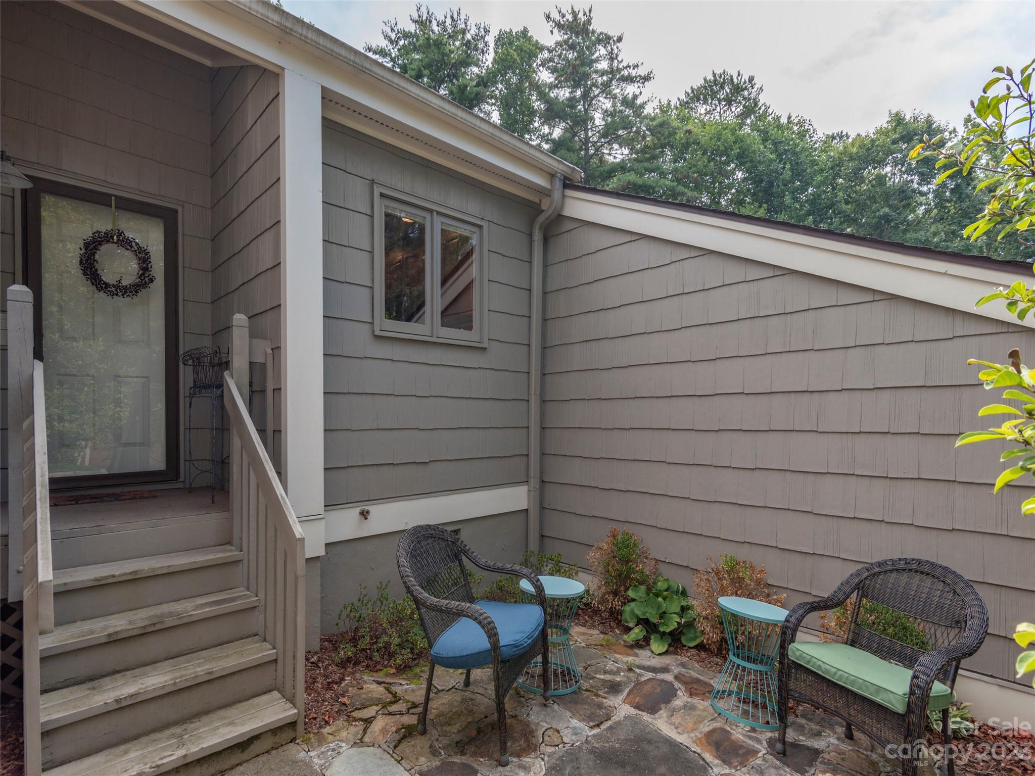 106 Beaver Ridge Road Asheville, NC 28804 - Photo 2 of 19 a backyard of a house with outdoor seating