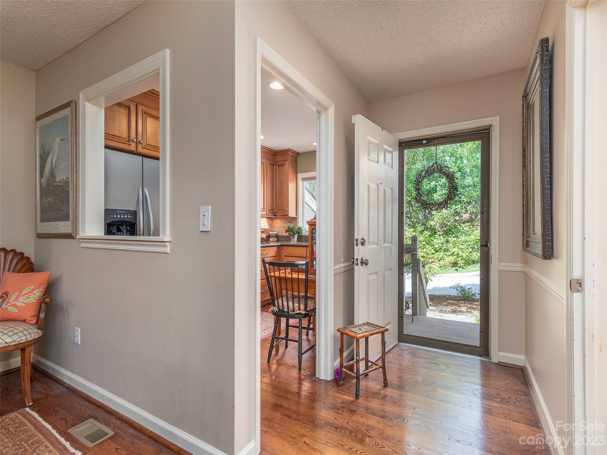 106 Beaver Ridge Road Asheville, NC 28804 - Photo 3 of 19 a view of a room that has a window and wooden floor