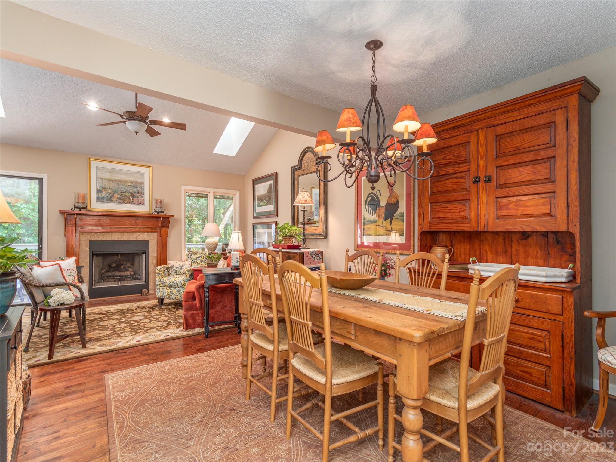 106 Beaver Ridge Road Asheville, NC 28804 - Photo 5 of 19 a view of a dining room with furniture window and wooden floor