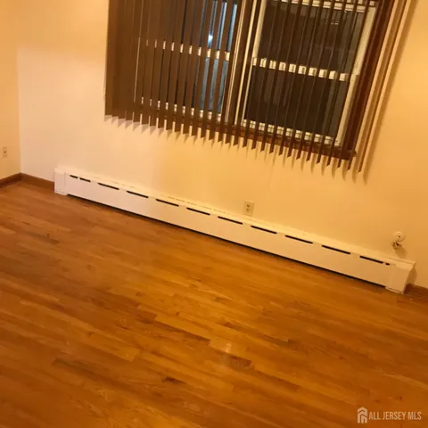 a view of front door with wooden floor