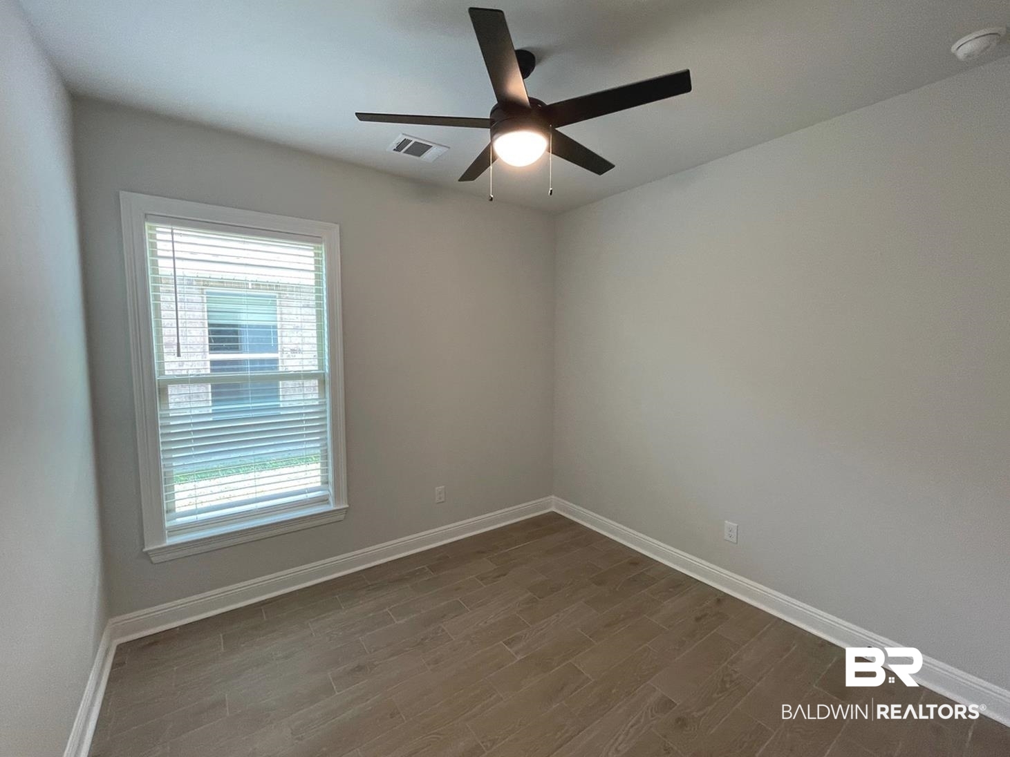 1626 Fenton Circle Foley, AL 36535 - Photo 10 of 16 Spare room with ceiling fan and dark hardwood / wood-style floors