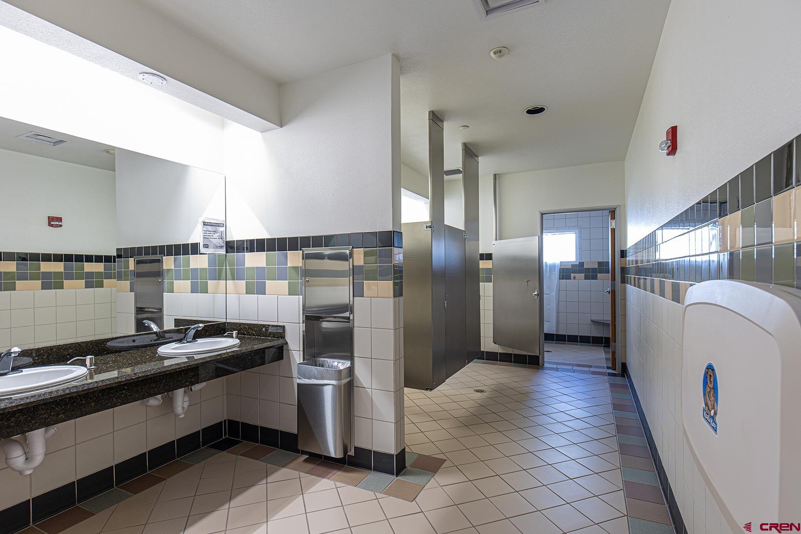 175 Mercado Street, Unit 234 Durango, CO 81301 - Photo 14 of 39 a kitchen with stainless steel appliances granite countertop a refrigerator and a stove