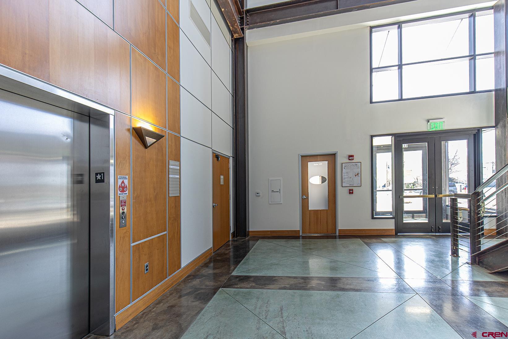 175 Mercado Street, Unit 234 Durango, CO 81301 - Photo 20 of 39 a view of an entryway with a floor to ceiling window and stairs