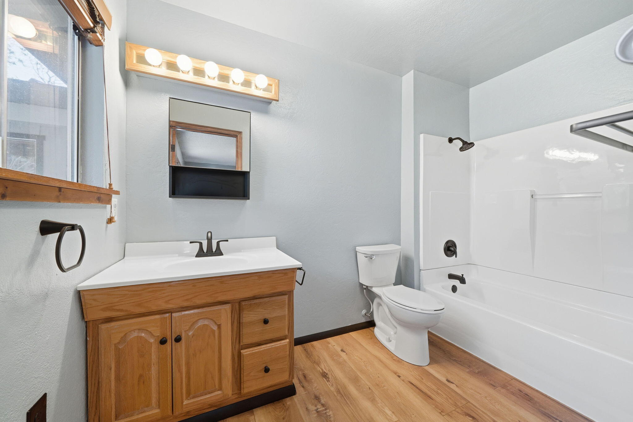 8489 Starlite Pines Road Shingletown, CA 96088 - Photo 11 of 26 a bathroom with a sink a toilet and shower