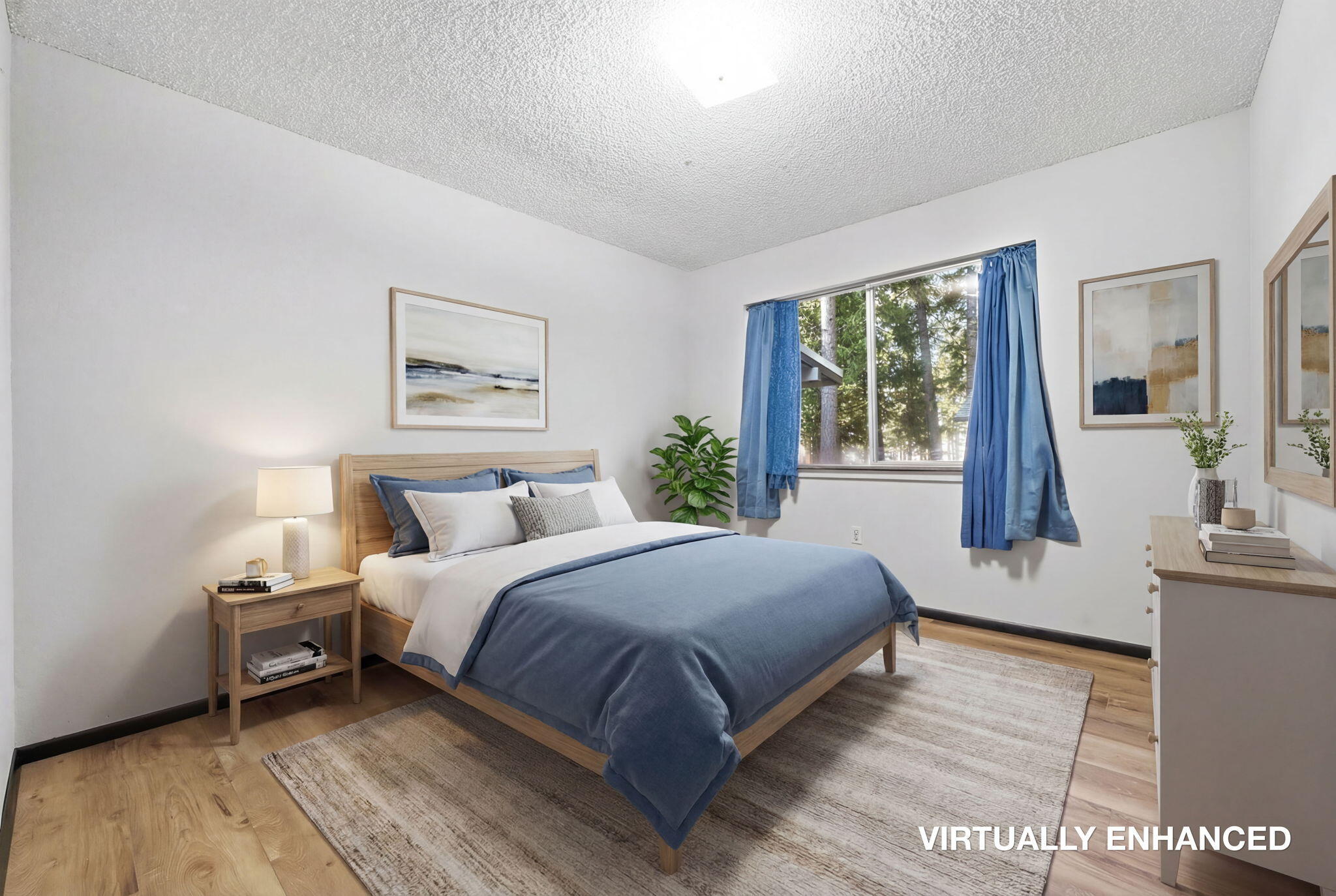 8489 Starlite Pines Road Shingletown, CA 96088 - Photo 12 of 26 a bedroom with a large bed and a large window