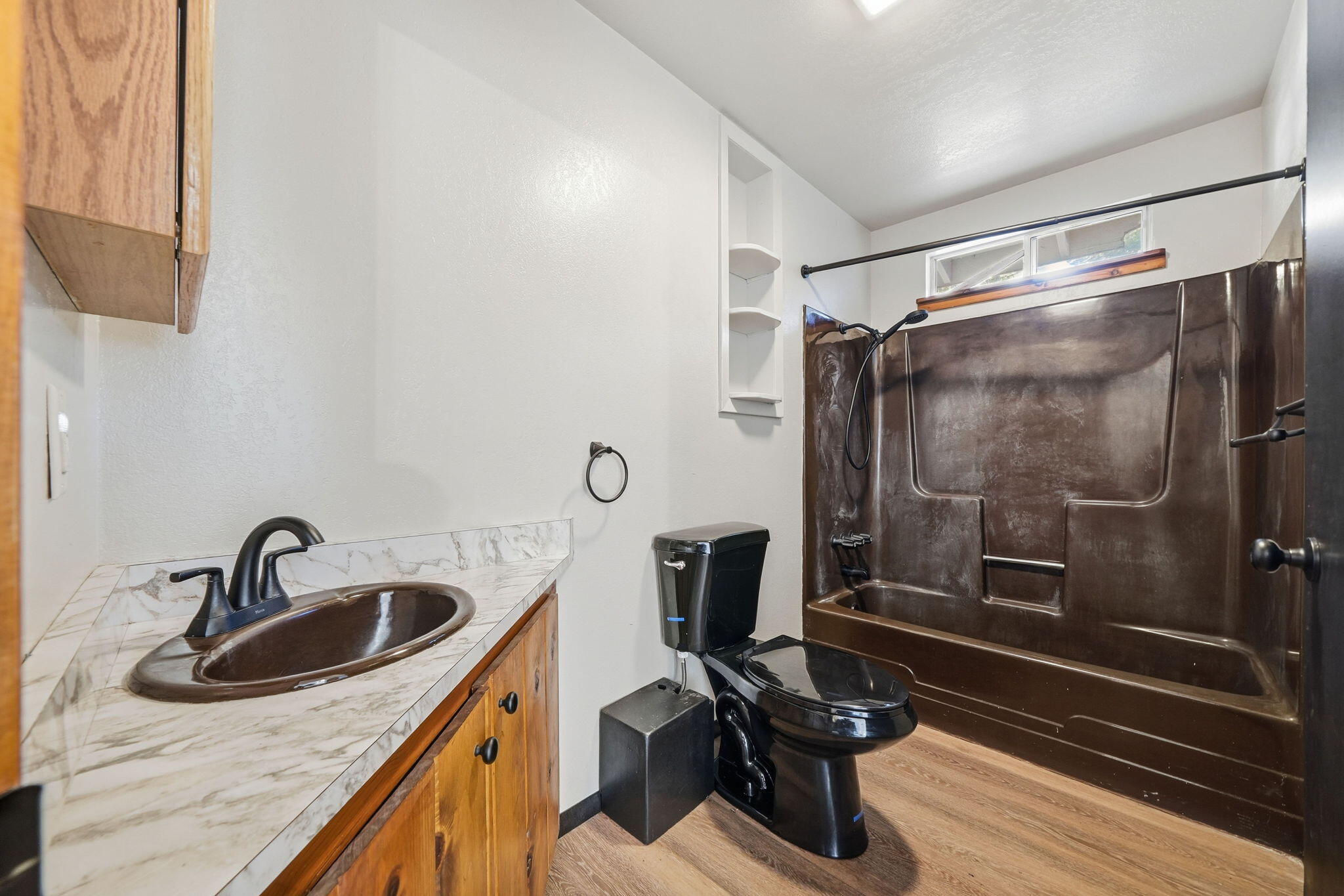 8489 Starlite Pines Road Shingletown, CA 96088 - Photo 16 of 26 a bathroom with a sink a toilet and a shower