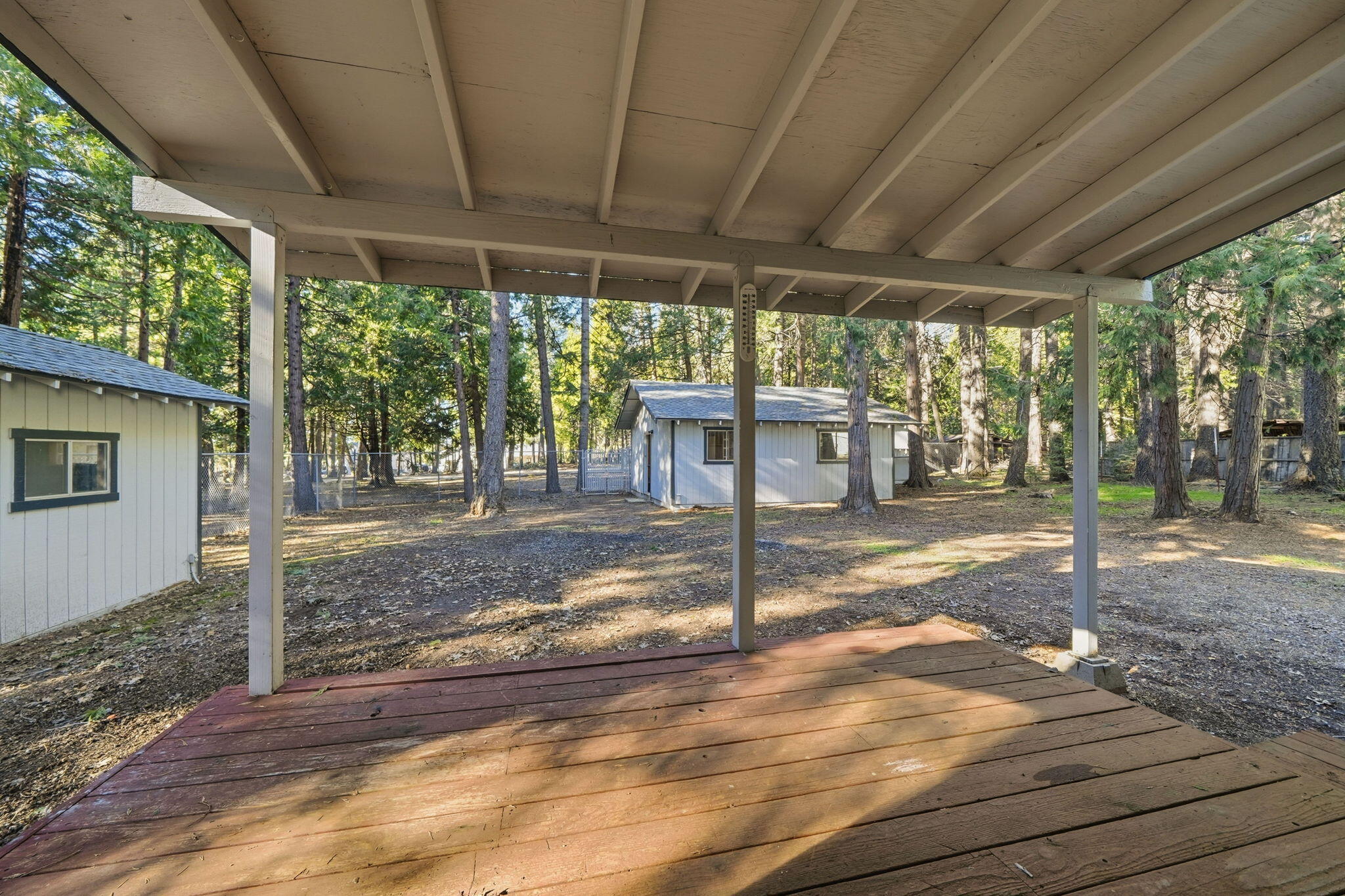 8489 Starlite Pines Road Shingletown, CA 96088 - Photo 19 of 26 a view of a porch with wooden floor