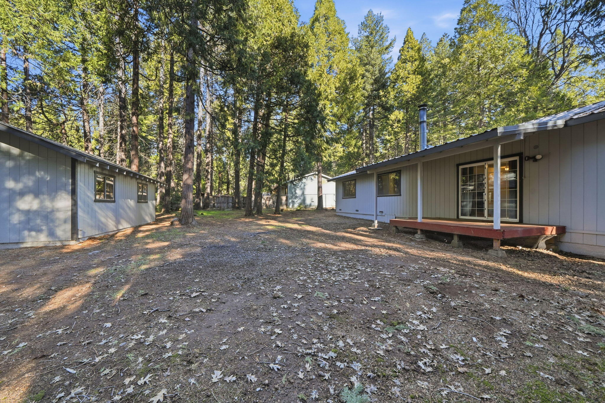 8489 Starlite Pines Road Shingletown, CA 96088 - Photo 21 of 26 a house view with a backyard space