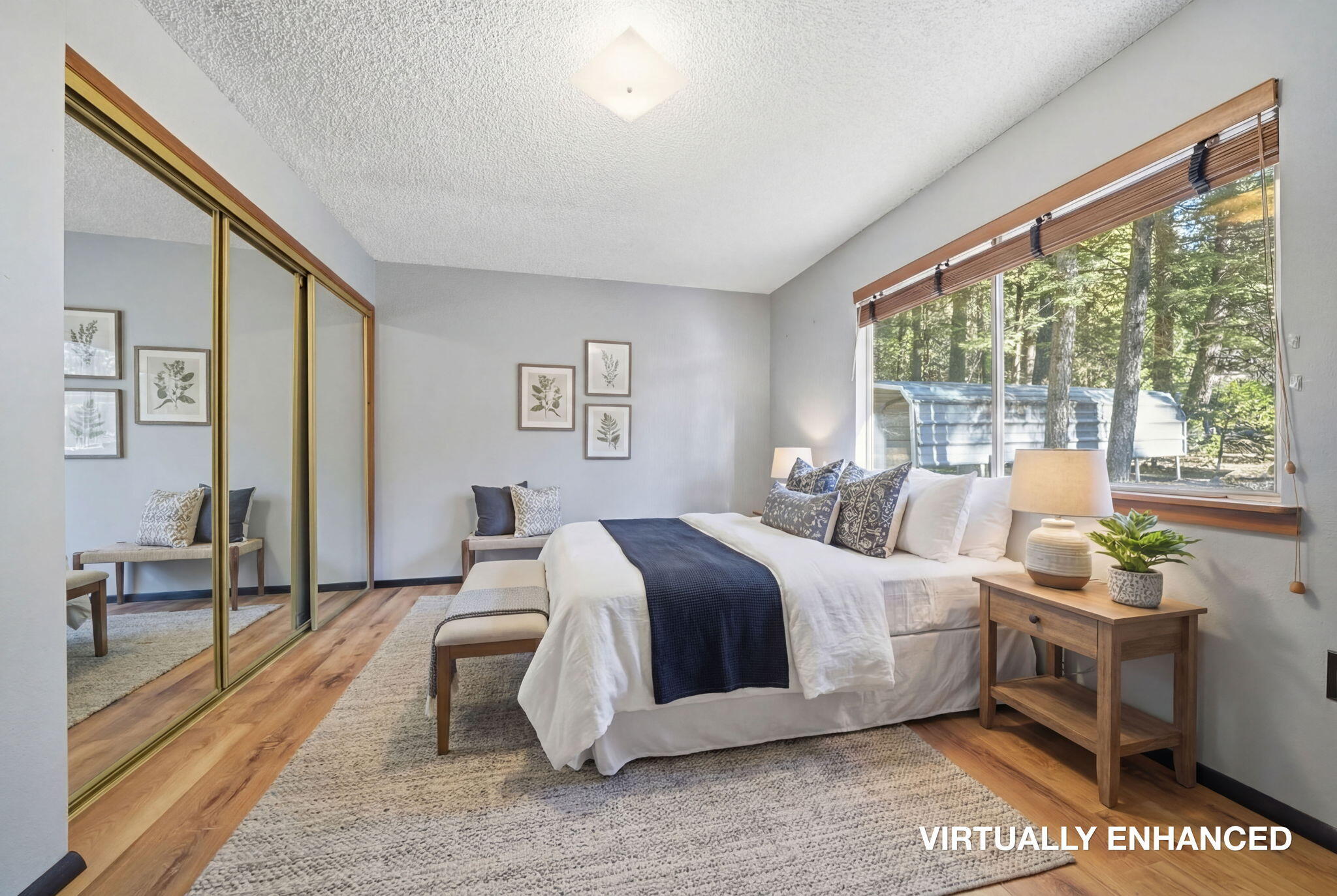 8489 Starlite Pines Road Shingletown, CA 96088 - Photo 9 of 26 a bedroom with a large bed and a large window