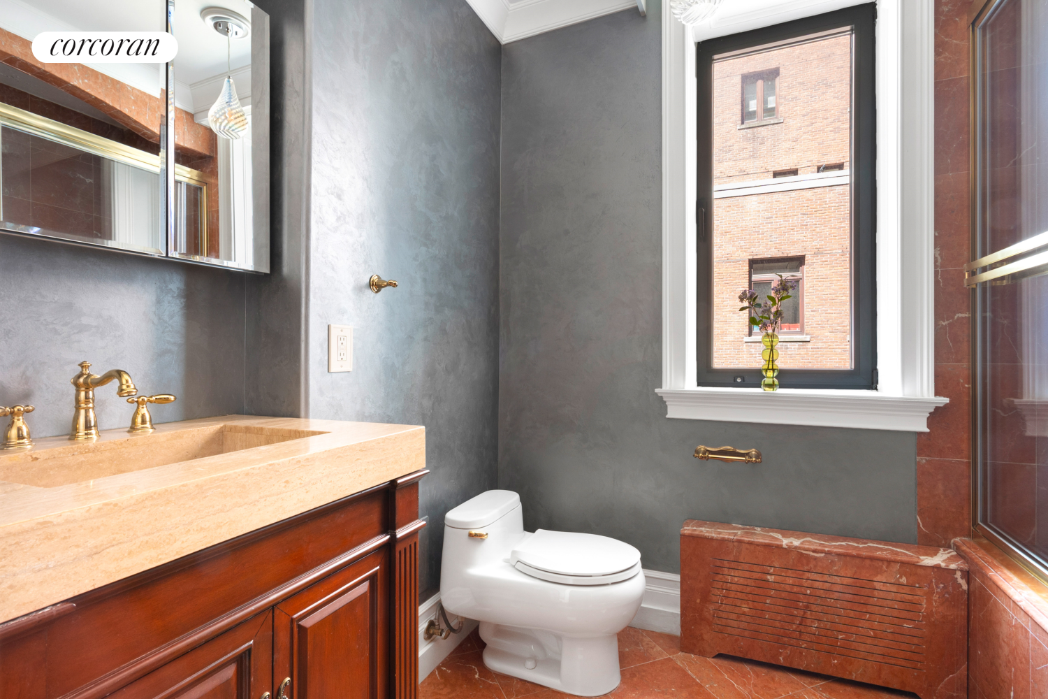 205 West 57th Street, Unit 3DC Manhattan, NY 10019 - Photo 6 of 18 a bathroom with a toilet a sink and a window