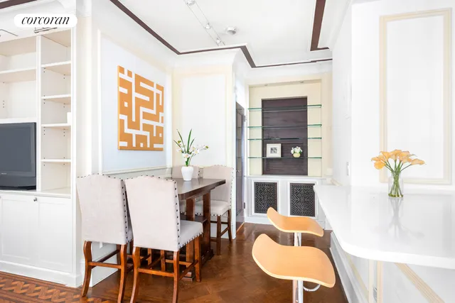 a dining room with furniture and window