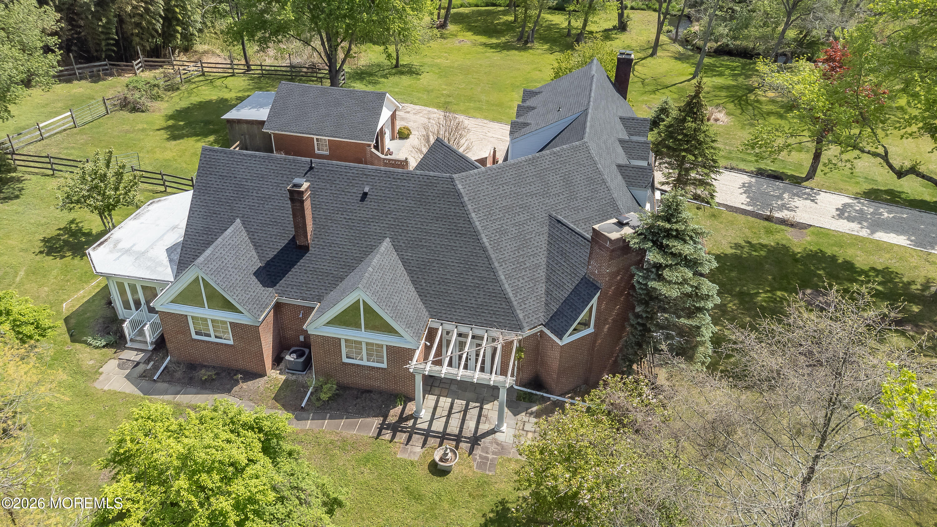 187 Hockhockson Road Colts Neck, NJ 07722 - Photo 5 of 55 an aerial view of a house with outdoor space swimming pool and lake view