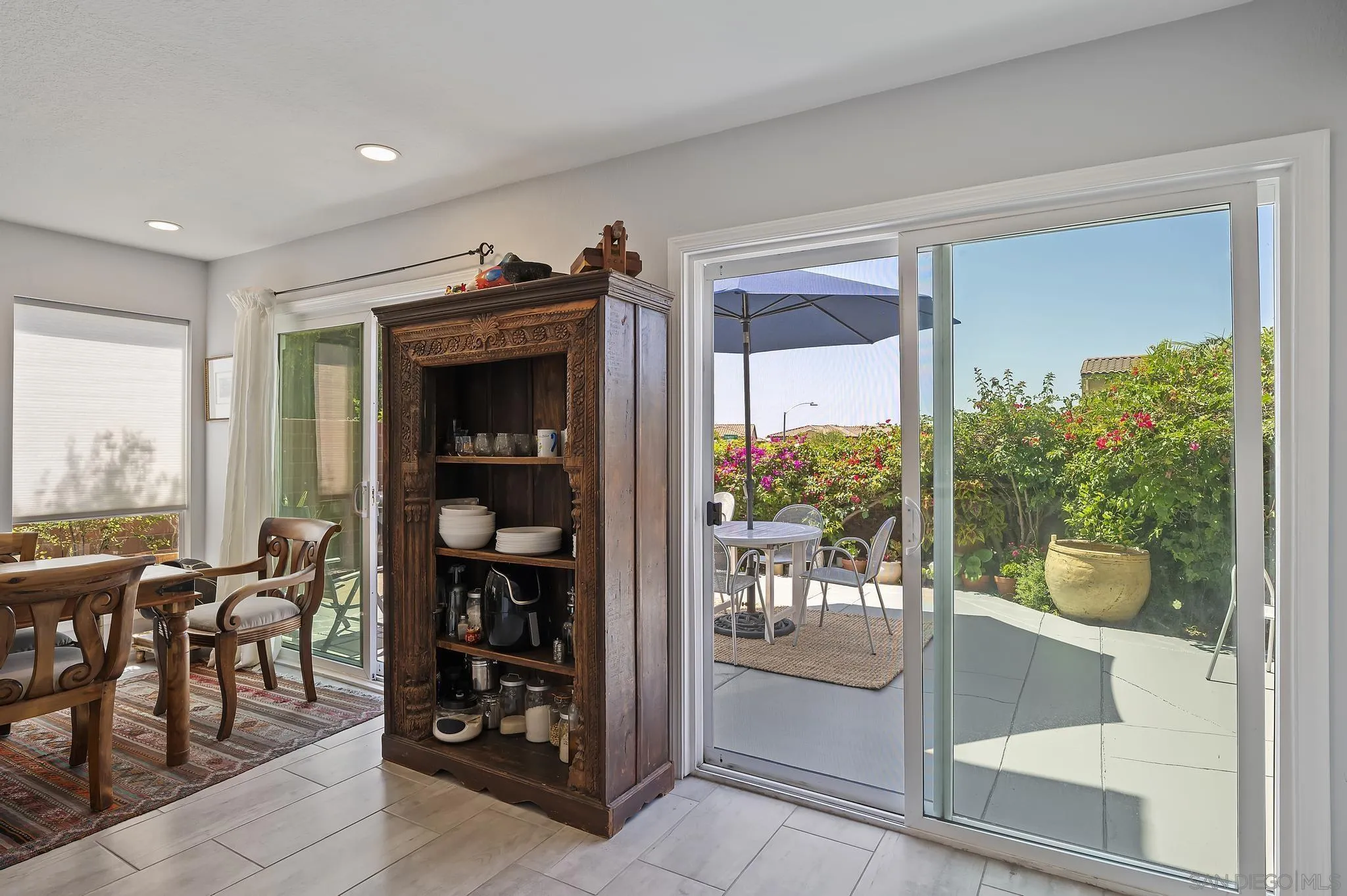 7015 Lavender Way Carlsbad, CA 92011 - Photo 14 of 67 a living room with furniture and a large window