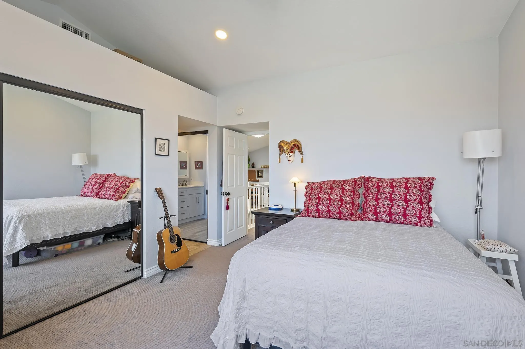 7015 Lavender Way Carlsbad, CA 92011 - Photo 28 of 67 a bedroom with a bed and a lamp