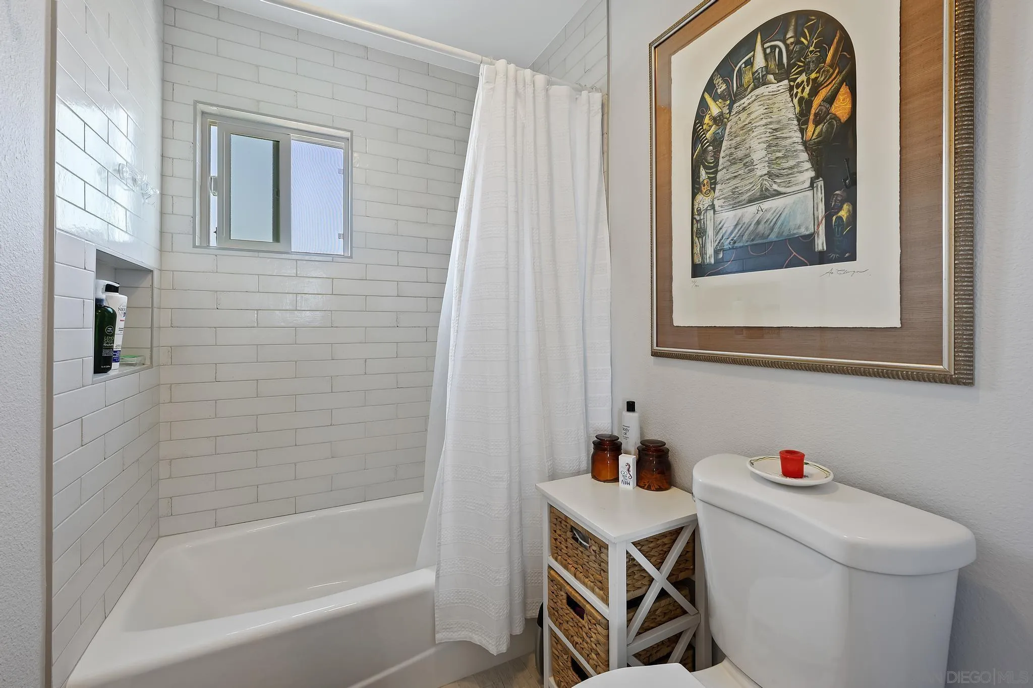 7015 Lavender Way Carlsbad, CA 92011 - Photo 30 of 67 a bathroom with a window a toilet and a shower