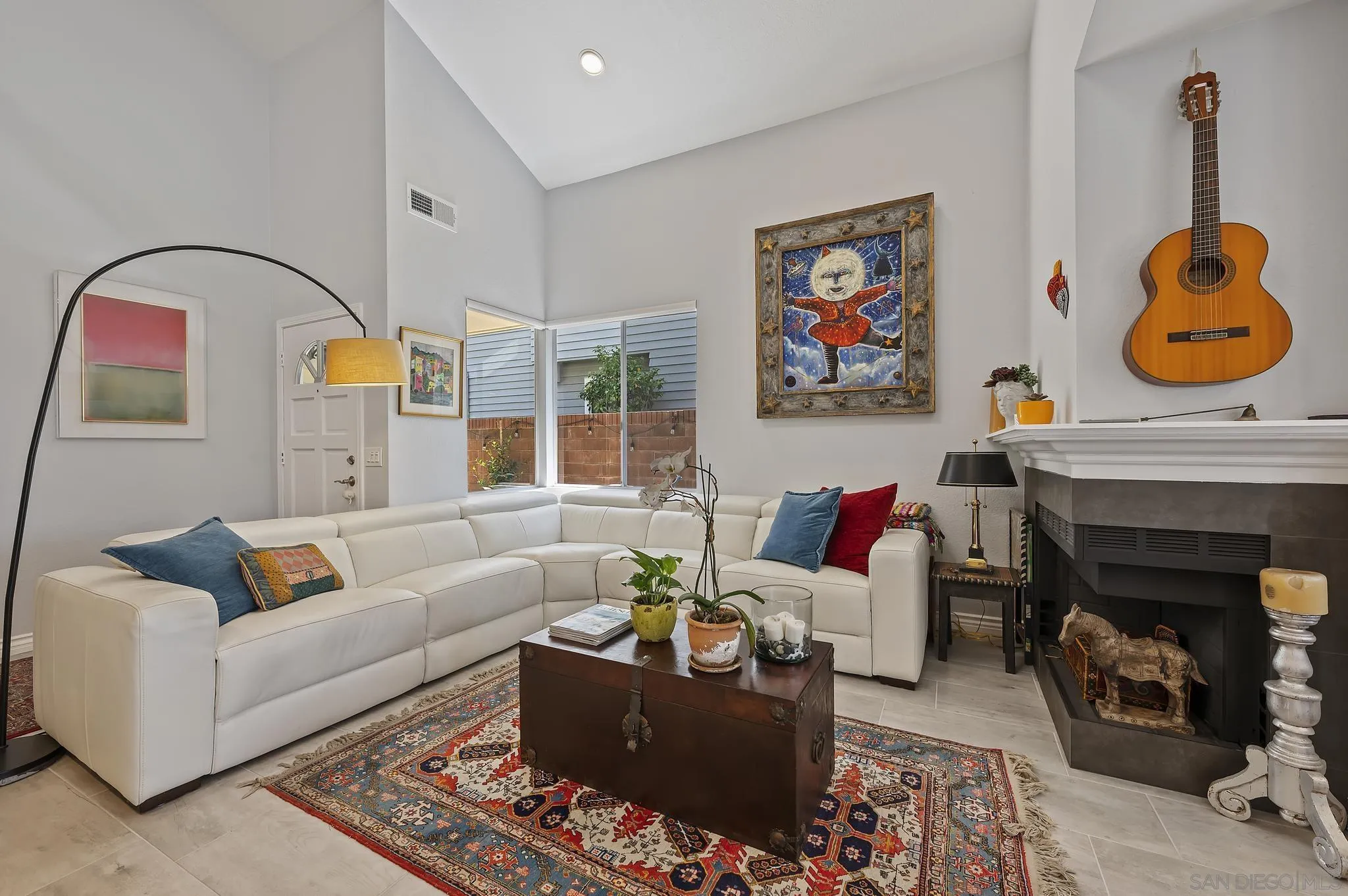 7015 Lavender Way Carlsbad, CA 92011 - Photo 3 of 67 a living room with furniture and a fireplace