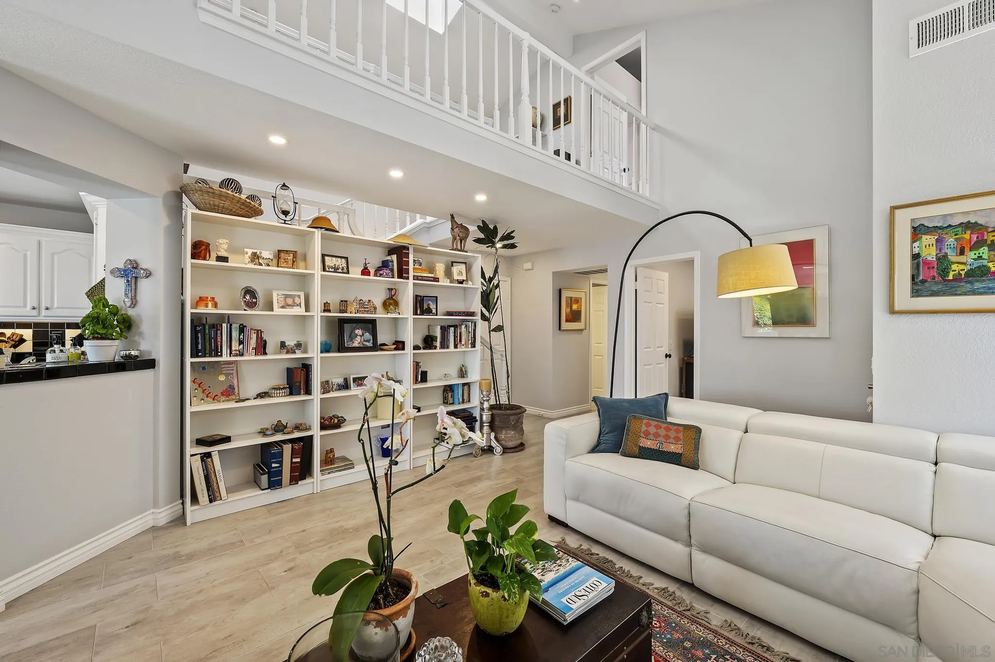7015 Lavender Way Carlsbad, CA 92011 - Photo 5 of 67 a living room with furniture a rug and a chandelier