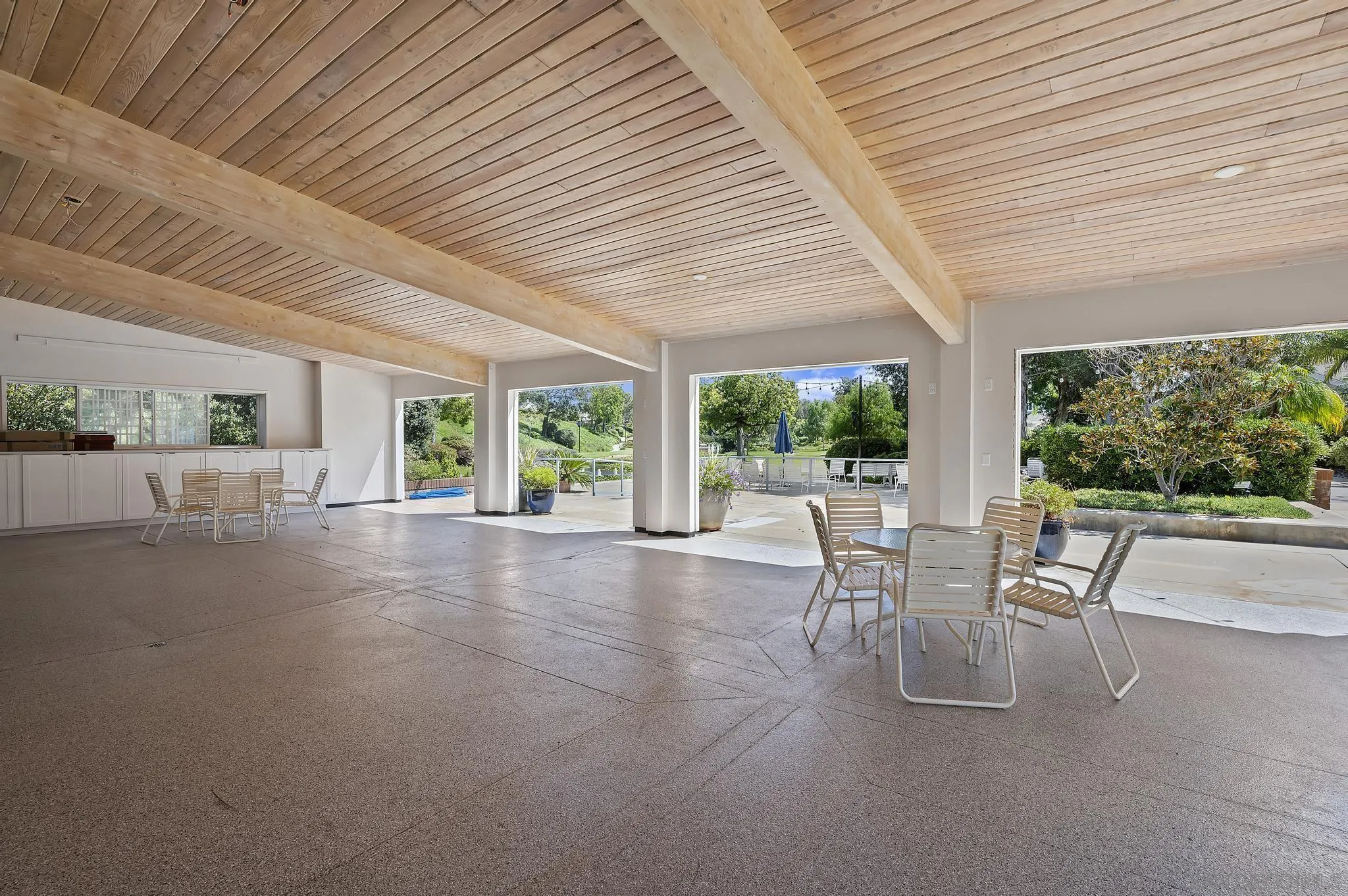 7015 Lavender Way Carlsbad, CA 92011 - Photo 56 of 67 a view of a patio with a table chairs and backyard