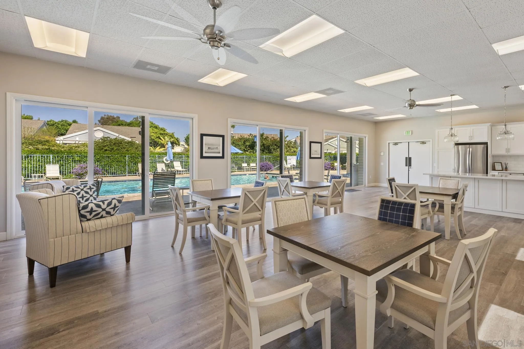 7015 Lavender Way Carlsbad, CA 92011 - Photo 63 of 67 a view of a dining room with furniture window and wooden floor