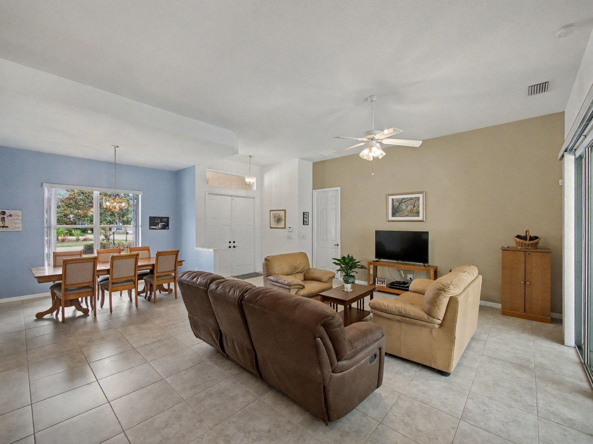 8122 Southwest Yachtsmans Drive Stuart, FL 34997 - Photo 11 of 43 a living room with furniture and a window
