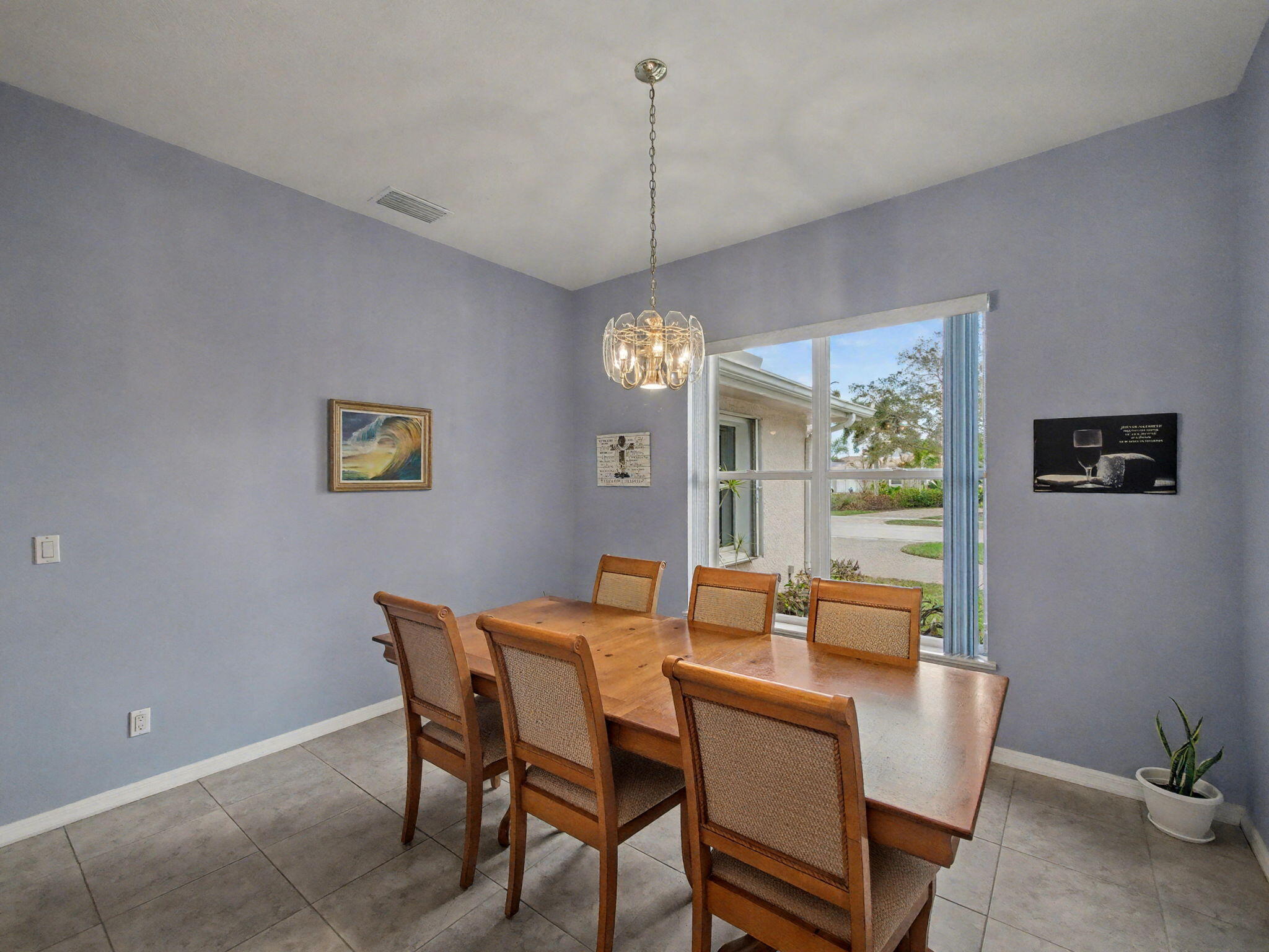 8122 Southwest Yachtsmans Drive Stuart, FL 34997 - Photo 12 of 43 a dining room with furniture and window