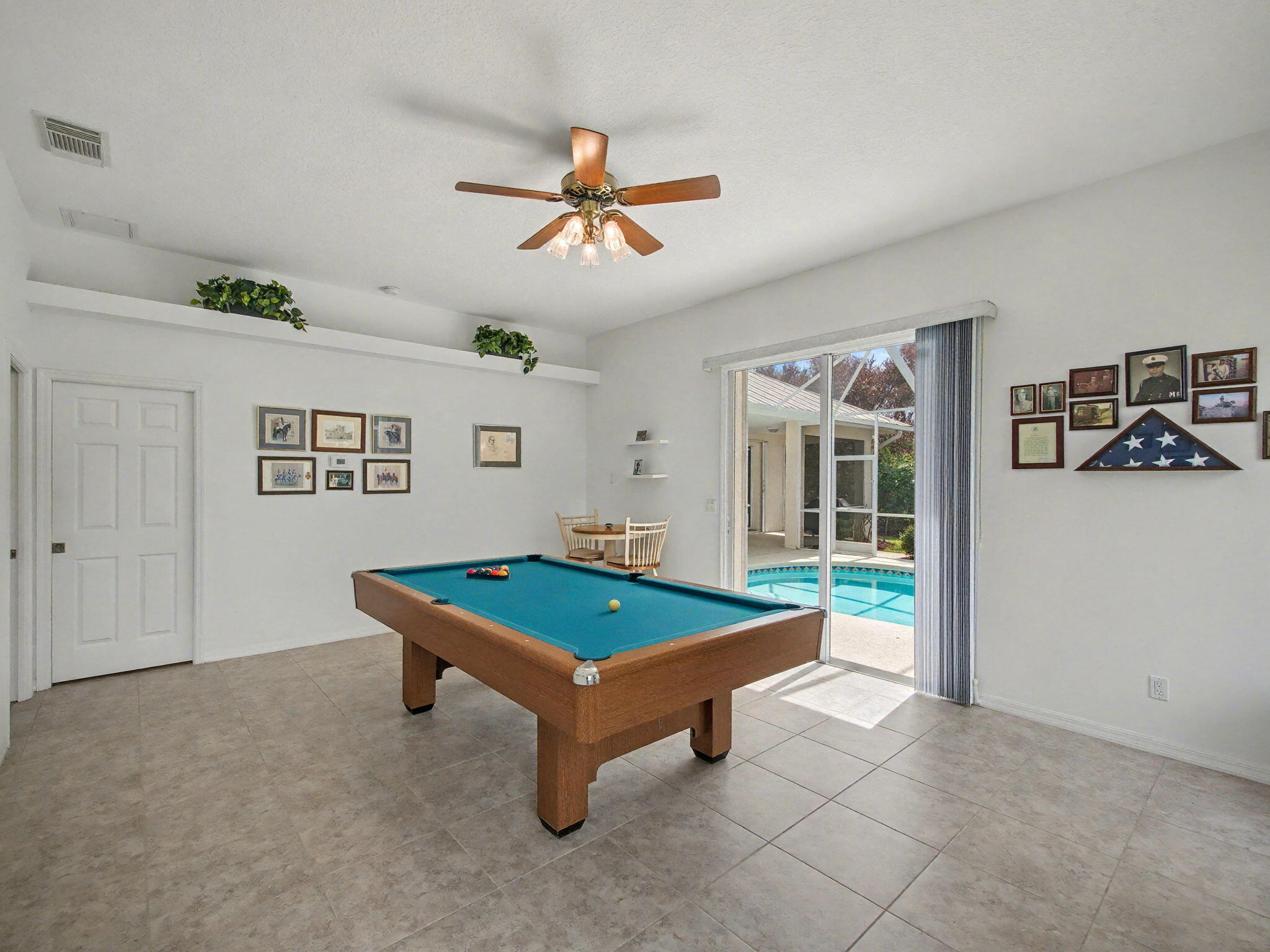 8122 Southwest Yachtsmans Drive Stuart, FL 34997 - Photo 18 of 43 a room with pool table and windows