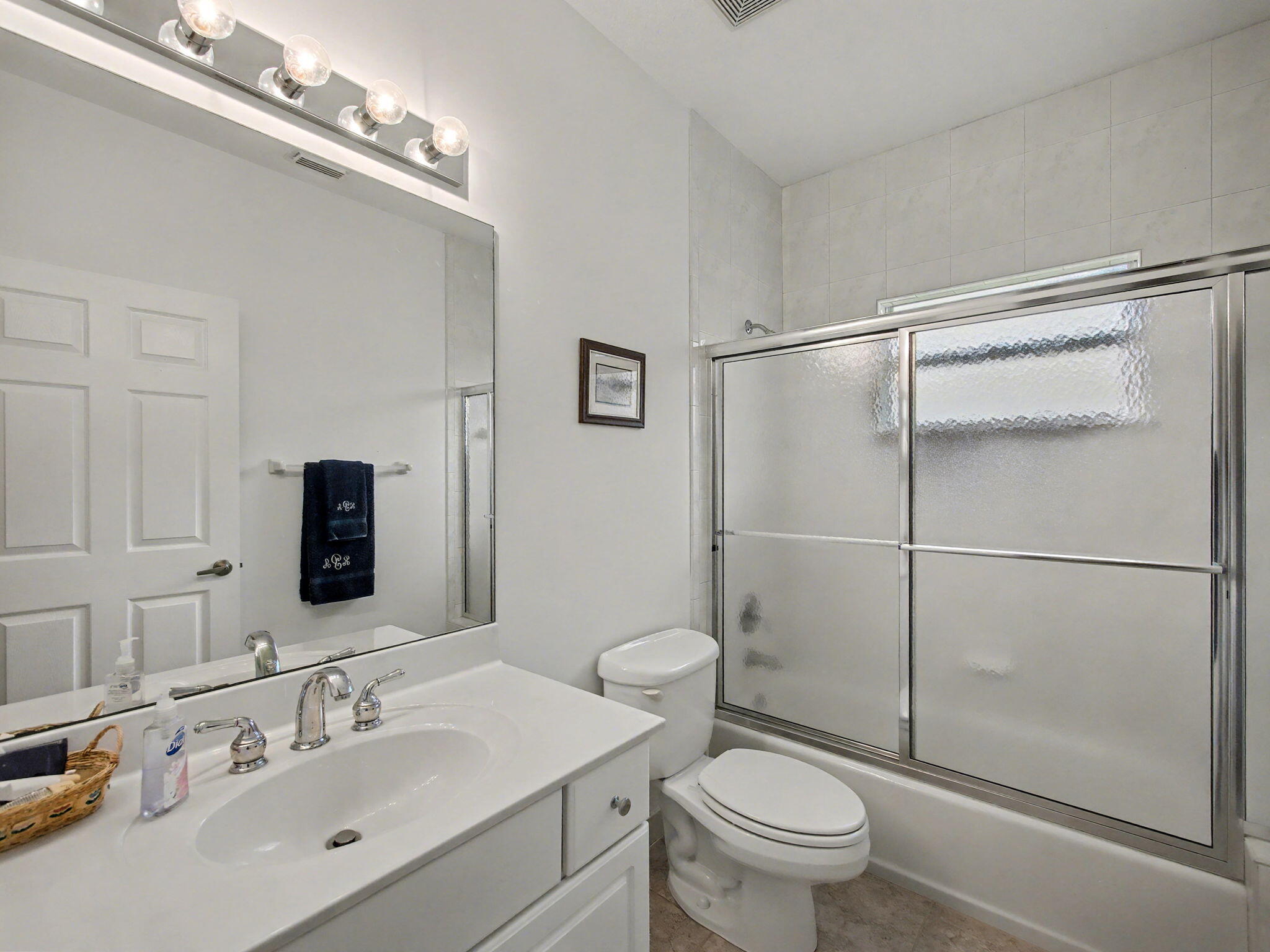 8122 Southwest Yachtsmans Drive Stuart, FL 34997 - Photo 24 of 43 a bathroom with a sink toilet and shower