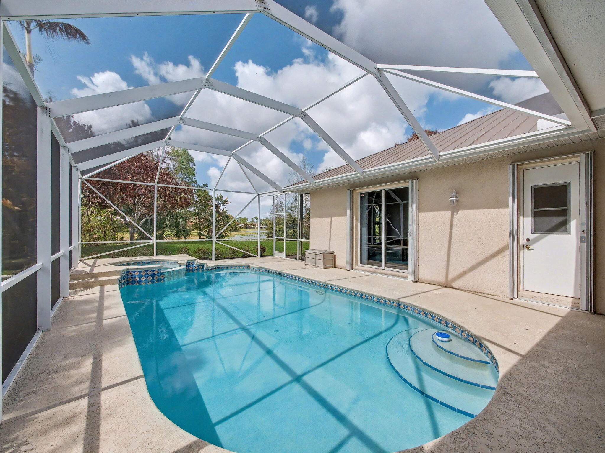 8122 Southwest Yachtsmans Drive Stuart, FL 34997 - Photo 31 of 43 a view of a swimming pool with a patio