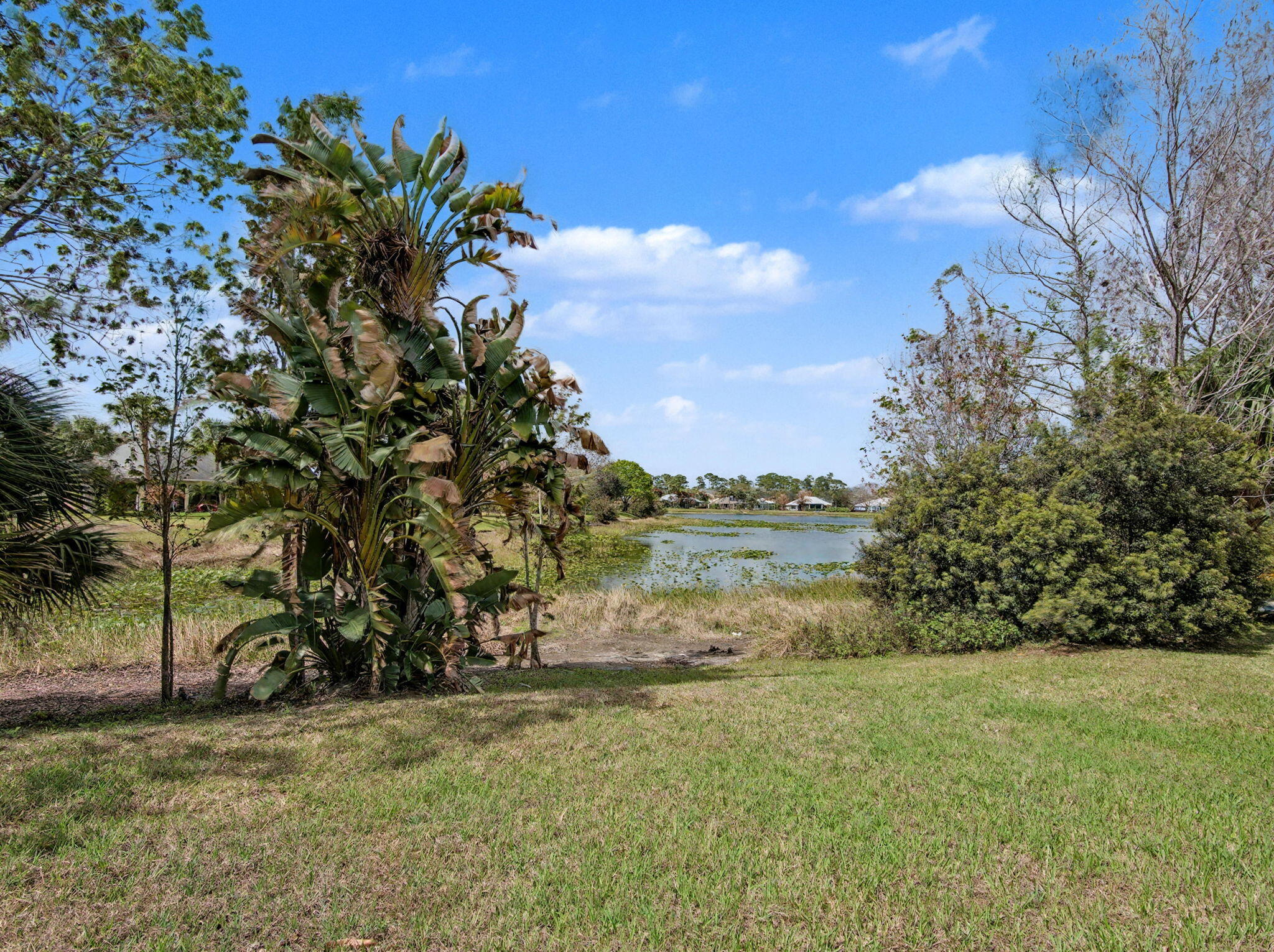 8122 Southwest Yachtsmans Drive Stuart, FL 34997 - Photo 35 of 43 a view of lake with houses