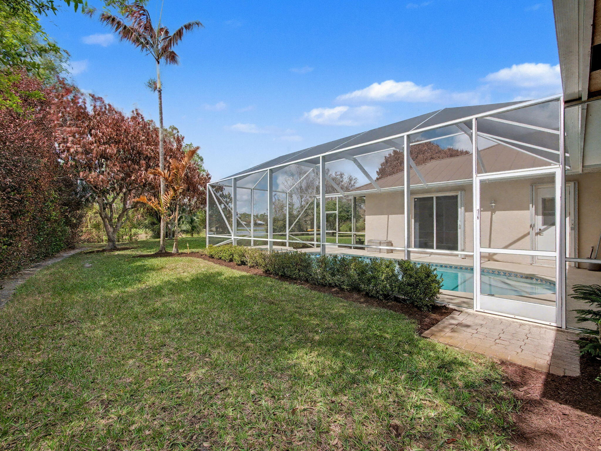 8122 Southwest Yachtsmans Drive Stuart, FL 34997 - Photo 36 of 43 a front view of a house with garden