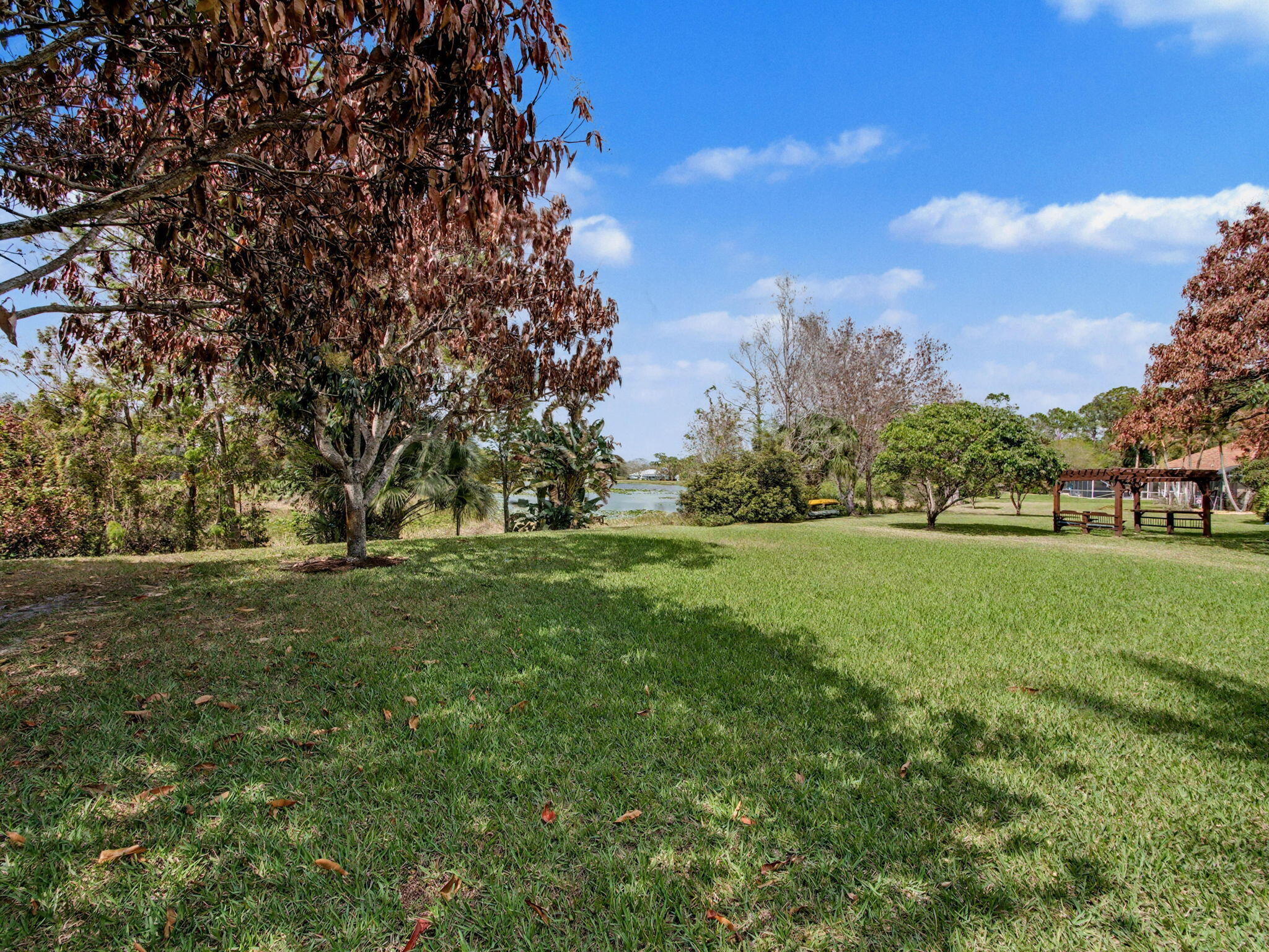 8122 Southwest Yachtsmans Drive Stuart, FL 34997 - Photo 37 of 43 a view of field with tall trees