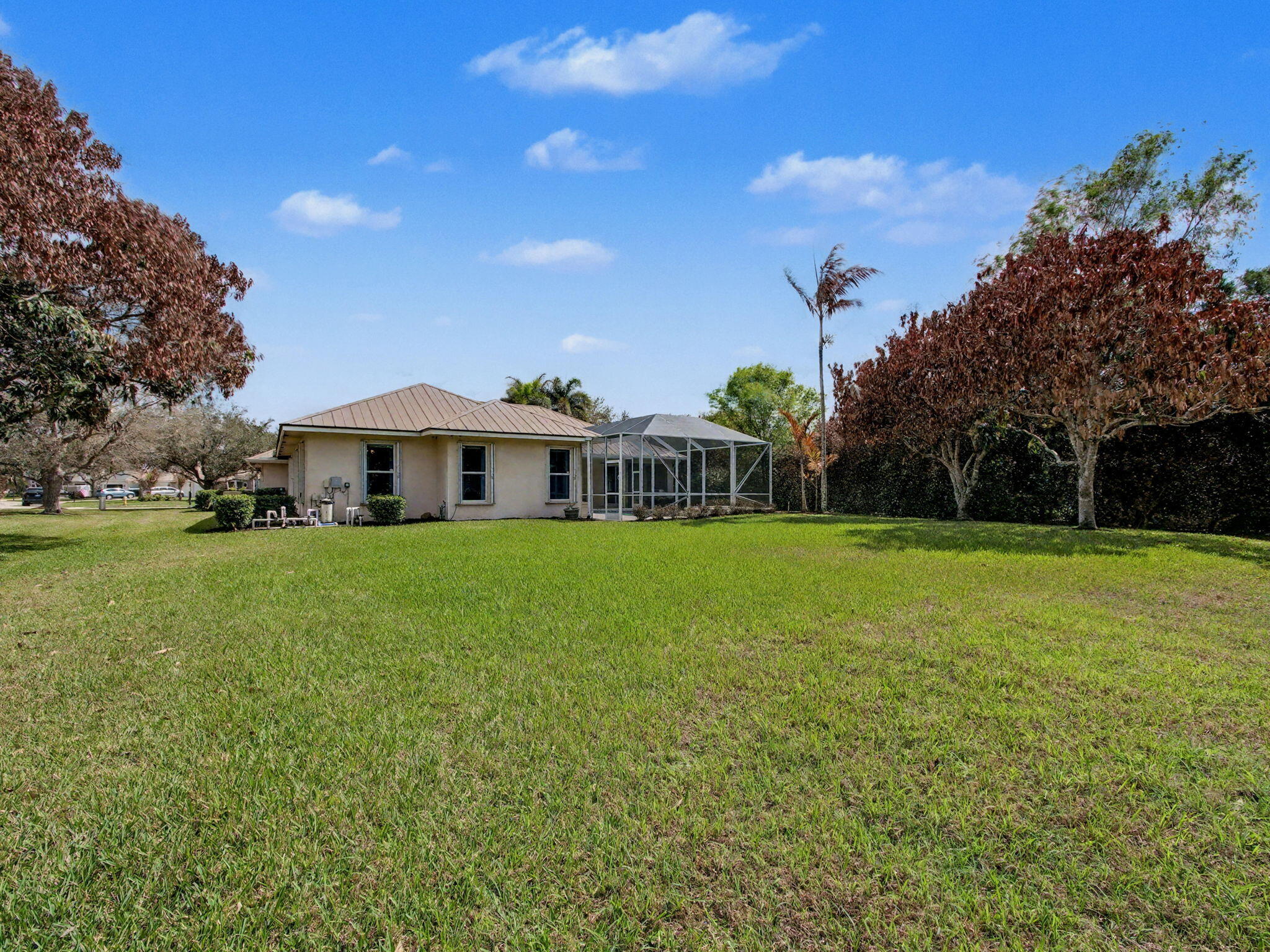 8122 Southwest Yachtsmans Drive Stuart, FL 34997 - Photo 38 of 43 a front view of house with yard and green space