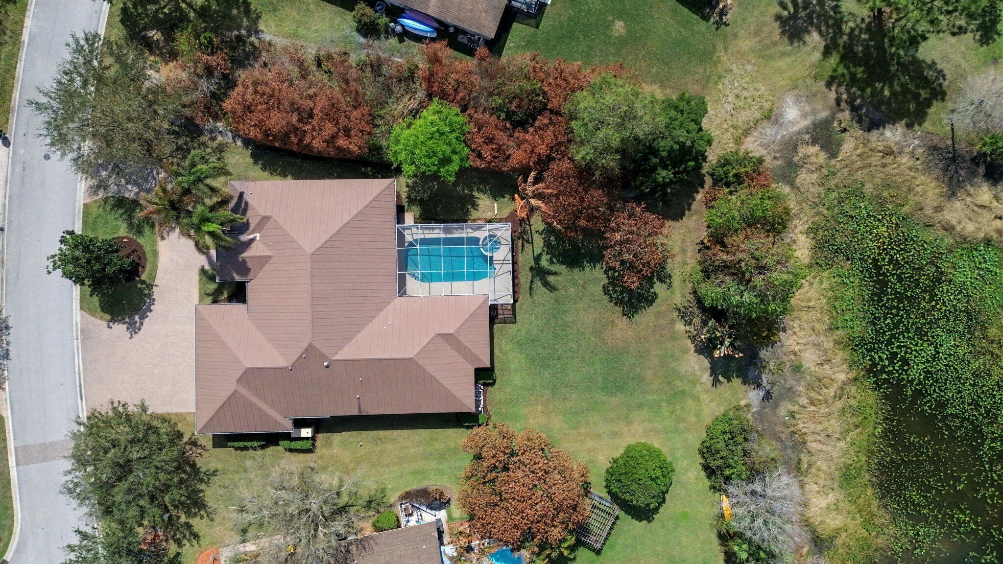 8122 Southwest Yachtsmans Drive Stuart, FL 34997 - Photo 40 of 43 an aerial view of a house with garden space and street view