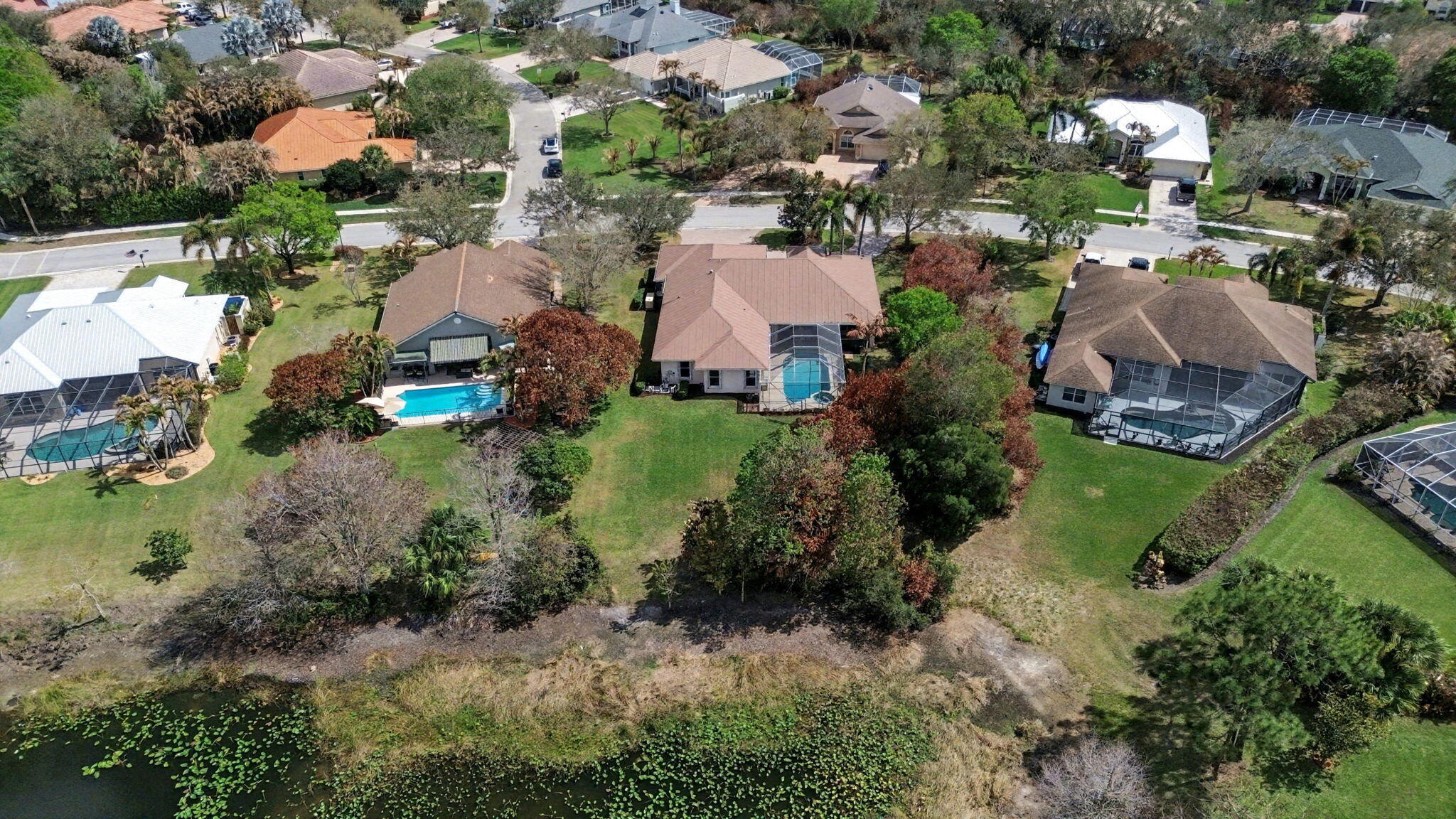 8122 Southwest Yachtsmans Drive Stuart, FL 34997 - Photo 41 of 43 an aerial view of residential houses with outdoor space and street view