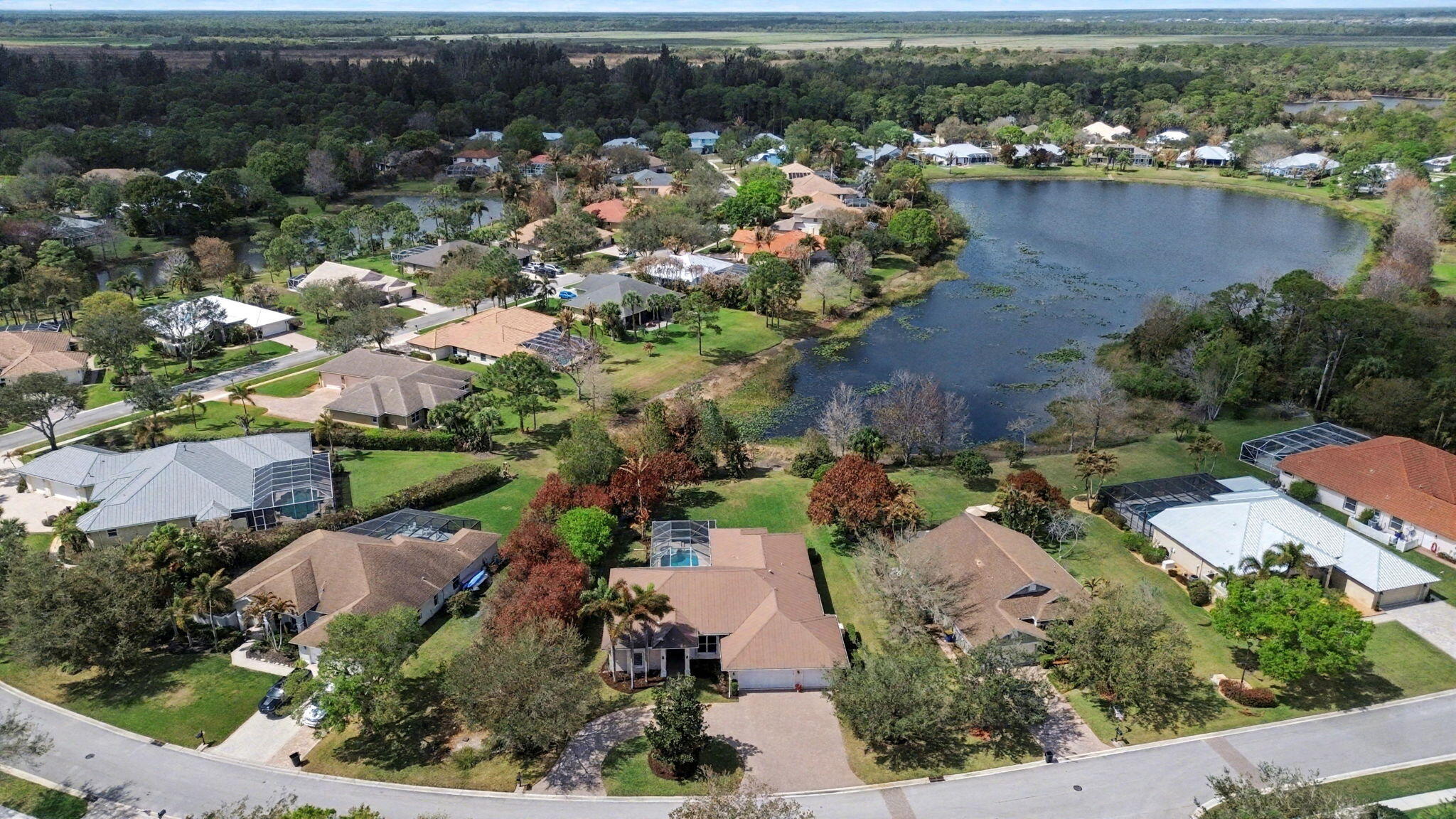 8122 Southwest Yachtsmans Drive Stuart, FL 34997 - Photo 7 of 43 an aerial view of lake residential house with outdoor space