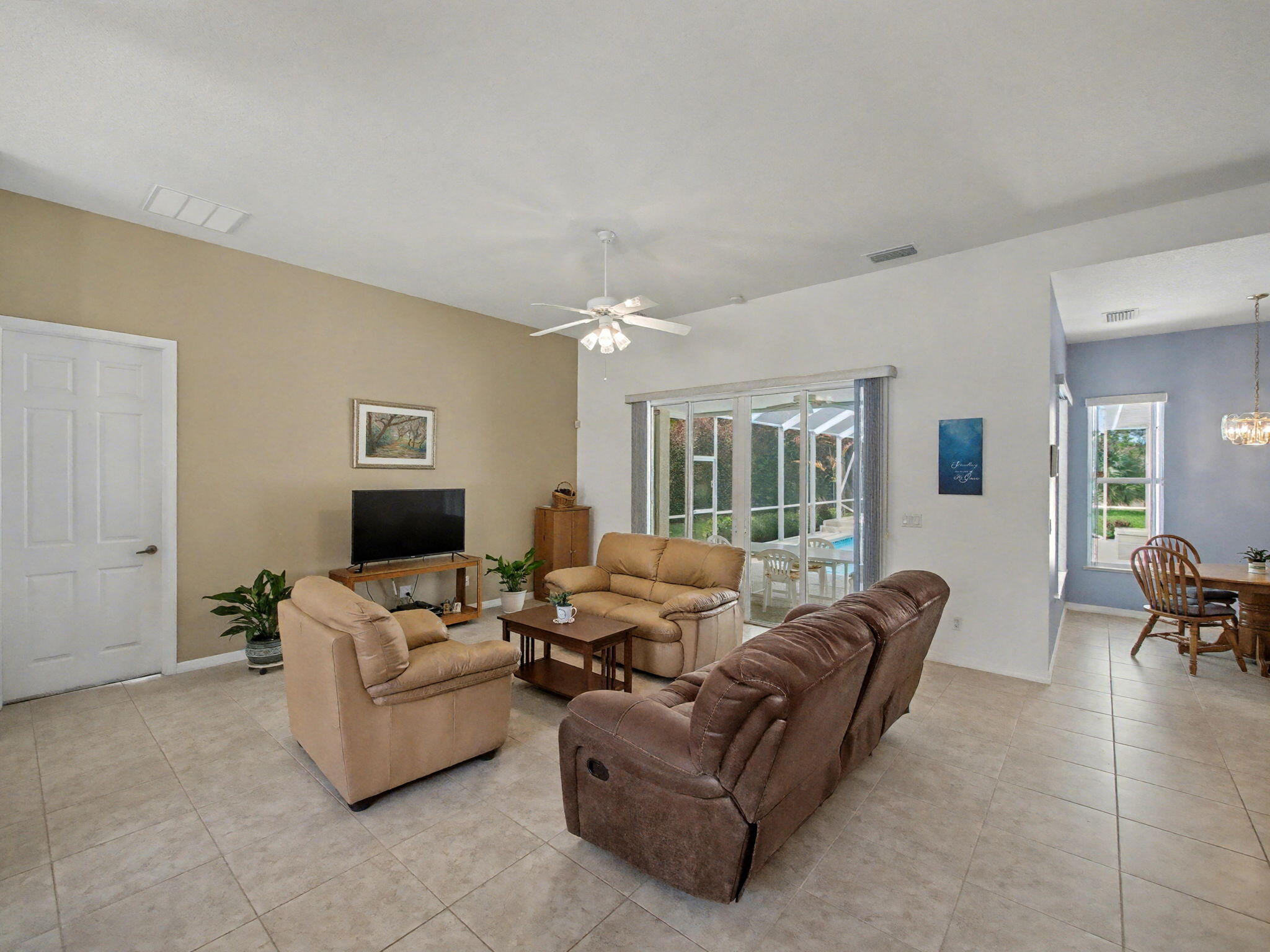 8122 Southwest Yachtsmans Drive Stuart, FL 34997 - Photo 10 of 43 a living room with furniture and a table