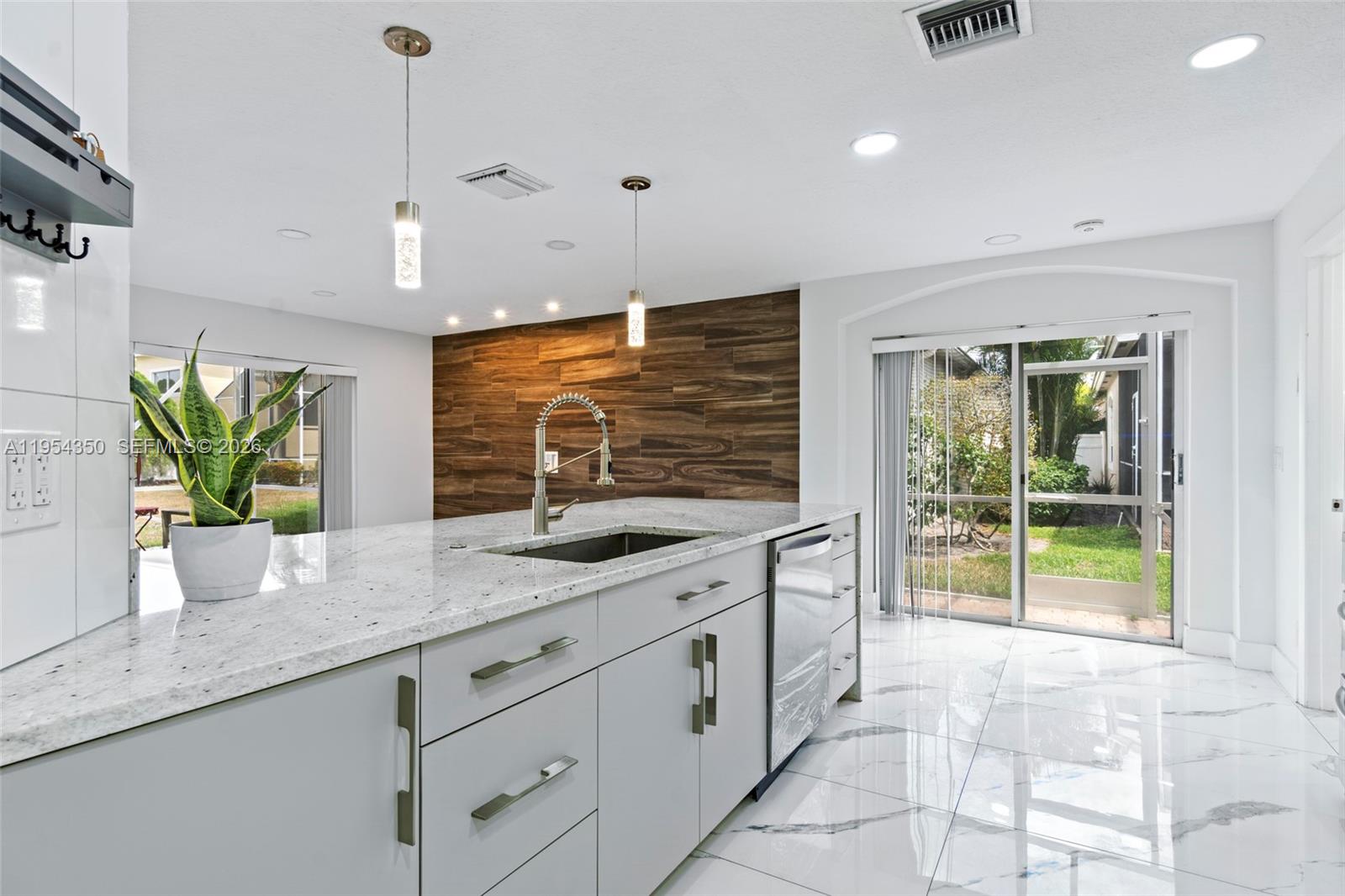6357 Brava Way, Unit 6357 Boca Raton, FL 33433 - Photo 13 of 45 Custom designed kitchen with abundance of natural light
