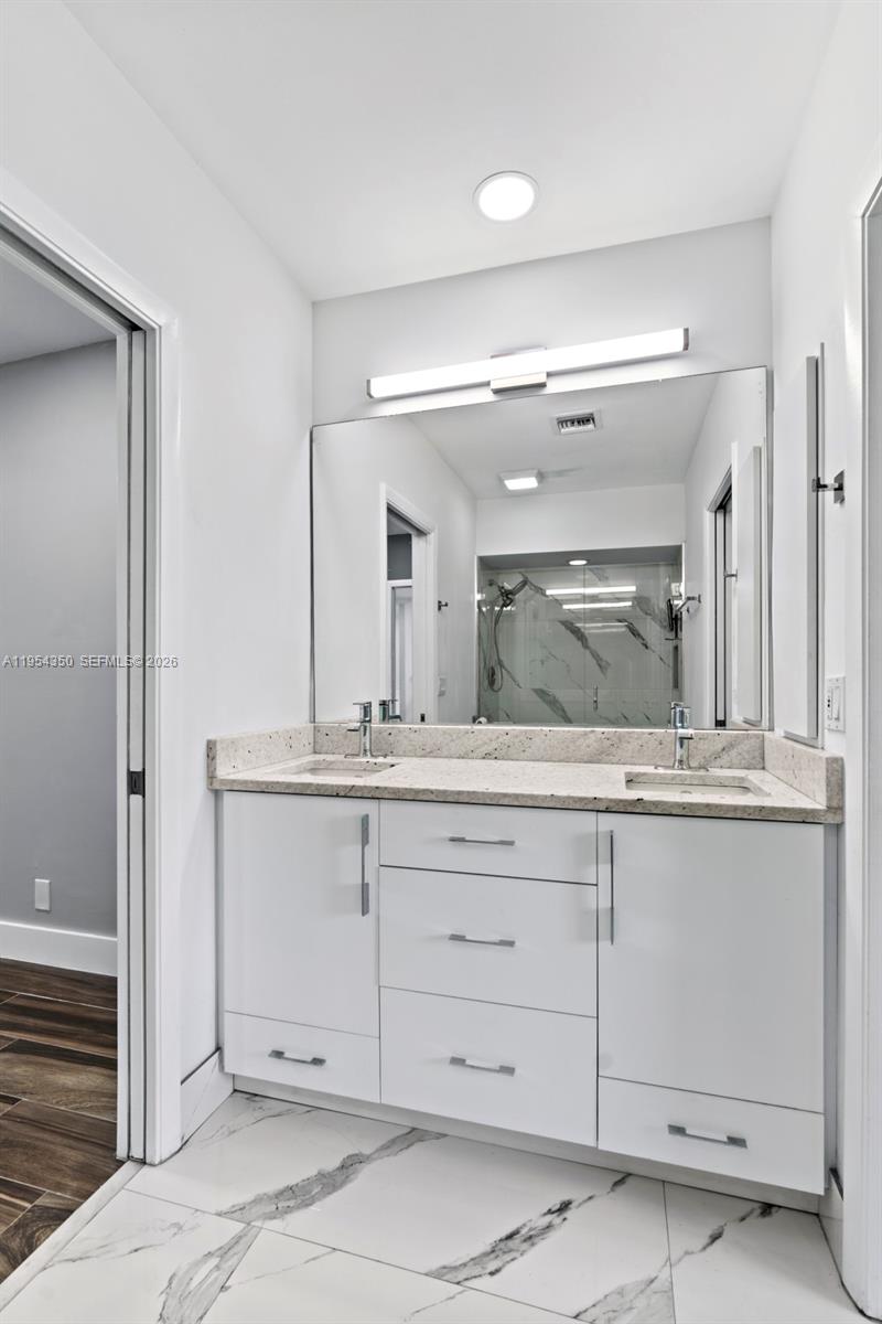 6357 Brava Way, Unit 6357 Boca Raton, FL 33433 - Photo 32 of 45 Jack & Jill Bathroom - double sink vanity